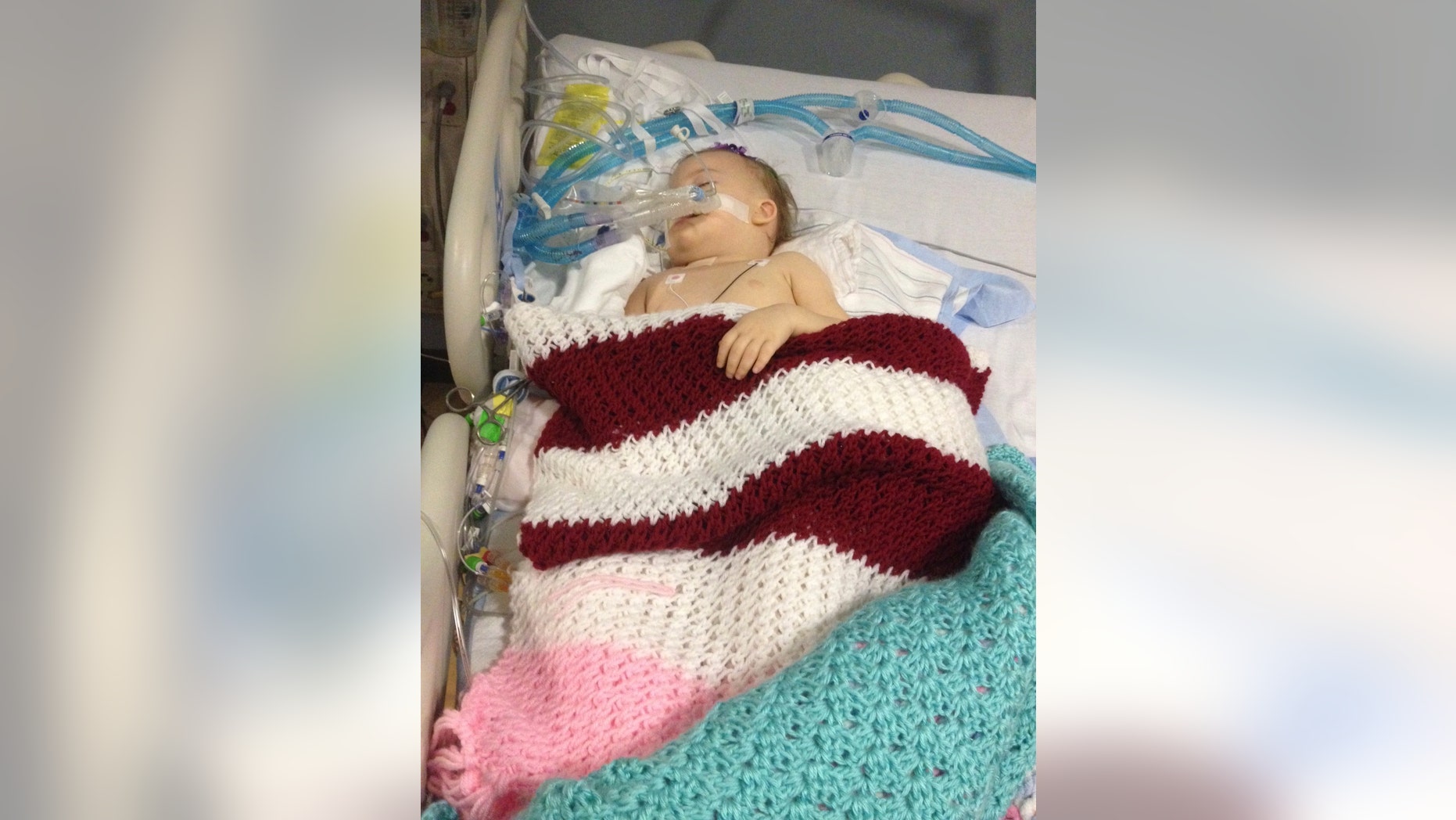 May 28, 2016: In this file photo provided by Patrick Lawson, his daughter Mirranda grace Lawson lies in her hospital bed at Virginia Commonwealth University Medical College of Virginia in Richmond, Va.