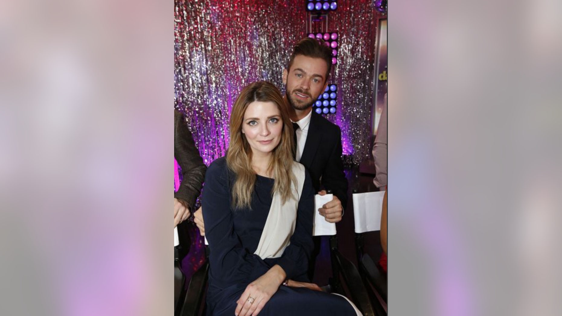 Mischa Barton, front, and Artem Chigvintsev pose together. ABC