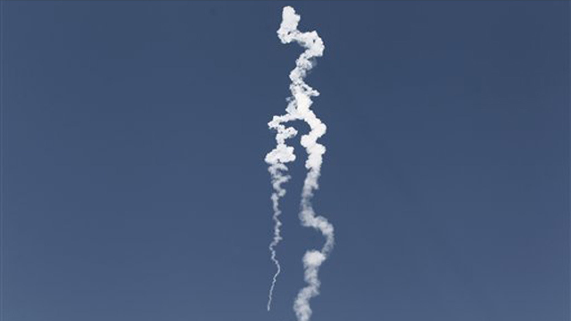 Nov. 2, 2011: A smoke trail of a missile test-fired by the Israeli army is seen from the central Israeli town of Yavne.