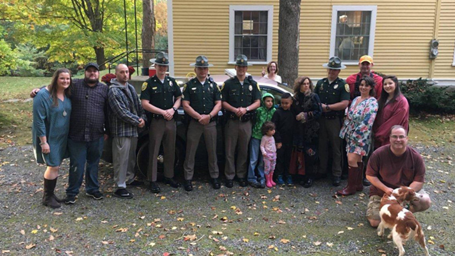 Photograph of the wedding party, along with members of New Hampshire State Police and NH Fish and Game.