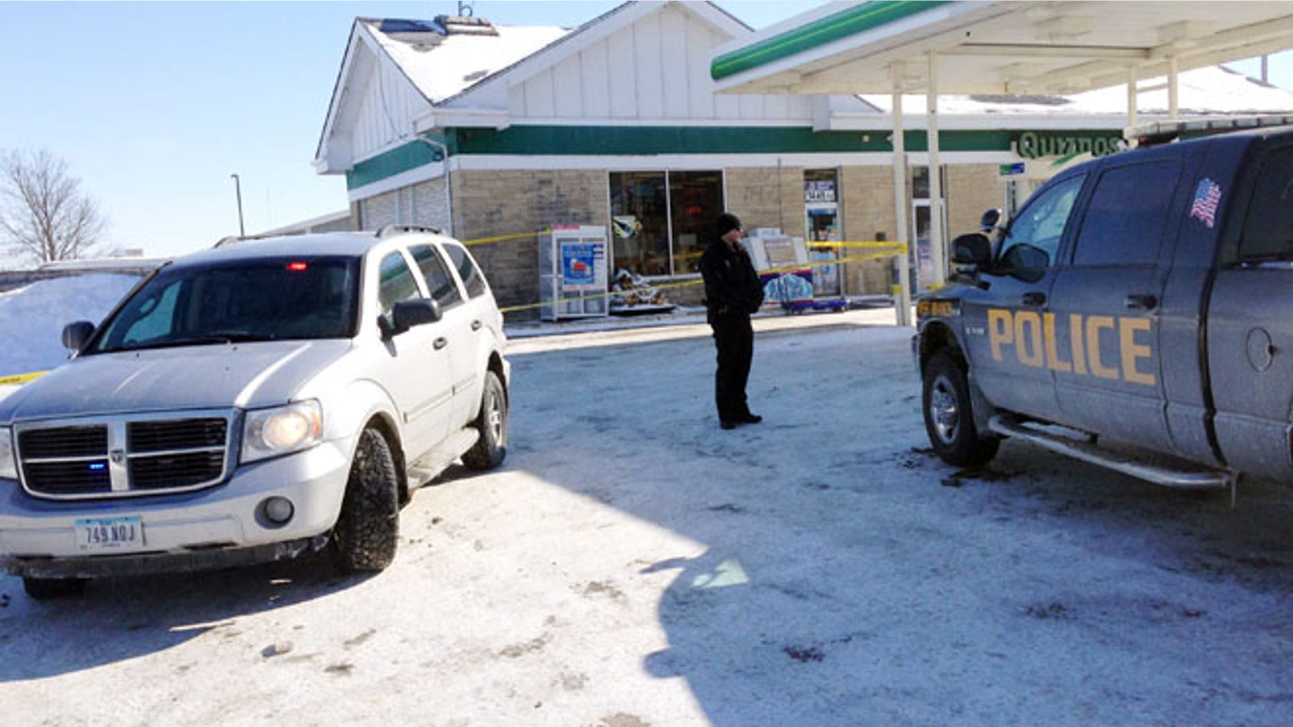 Feb. 7, 2014: Authorities gather at a gas station in West Branch, Iowa, where a missing newborn was found alive.