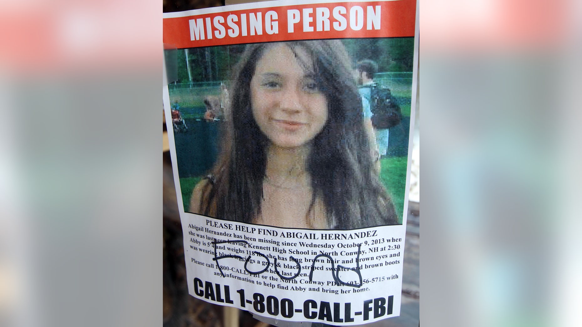 July 22, 2014: In this file photo of a missing person poster of Abigail Hernandez displayed in a storefront window in North Conway, N.H., shows Hernandez has been found.