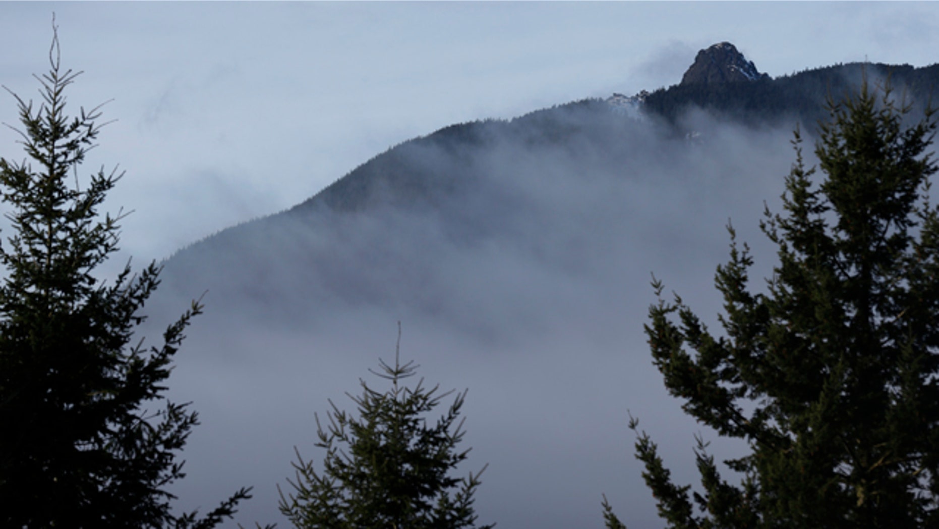 Jan. 4, 2013: Rugged terrain surrounds the summit of Mount Si, upper right, near North Bend, Wash.