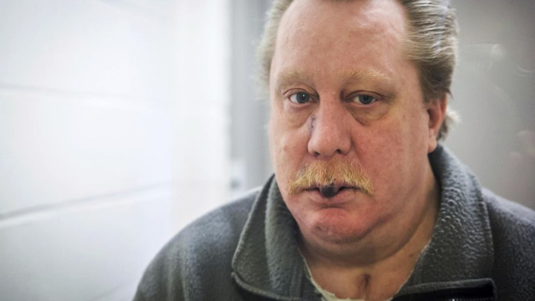 This undated photo provided by Jeremy Weis Photography, shows Russell Bucklew, who is scheduled to die by injection Tuesday, March 20, 2018, for killing a former girlfriend's new boyfriend in 1996 in eastern Missouri. Bucklew faces a potentially "gruesome and painful" execution because of a rare medical condition that compromises the man's veins and causes multiple tumors in his head and throat, his attorney said Sunday. (Jeremy Weis Photography via AP)
