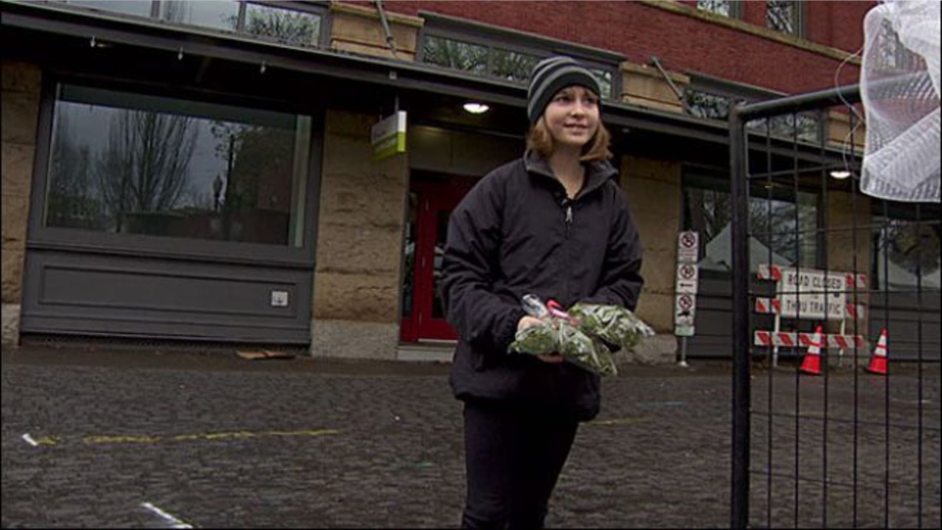 Madison Root, 11, holding some of the mistletoe she was told not to sell.