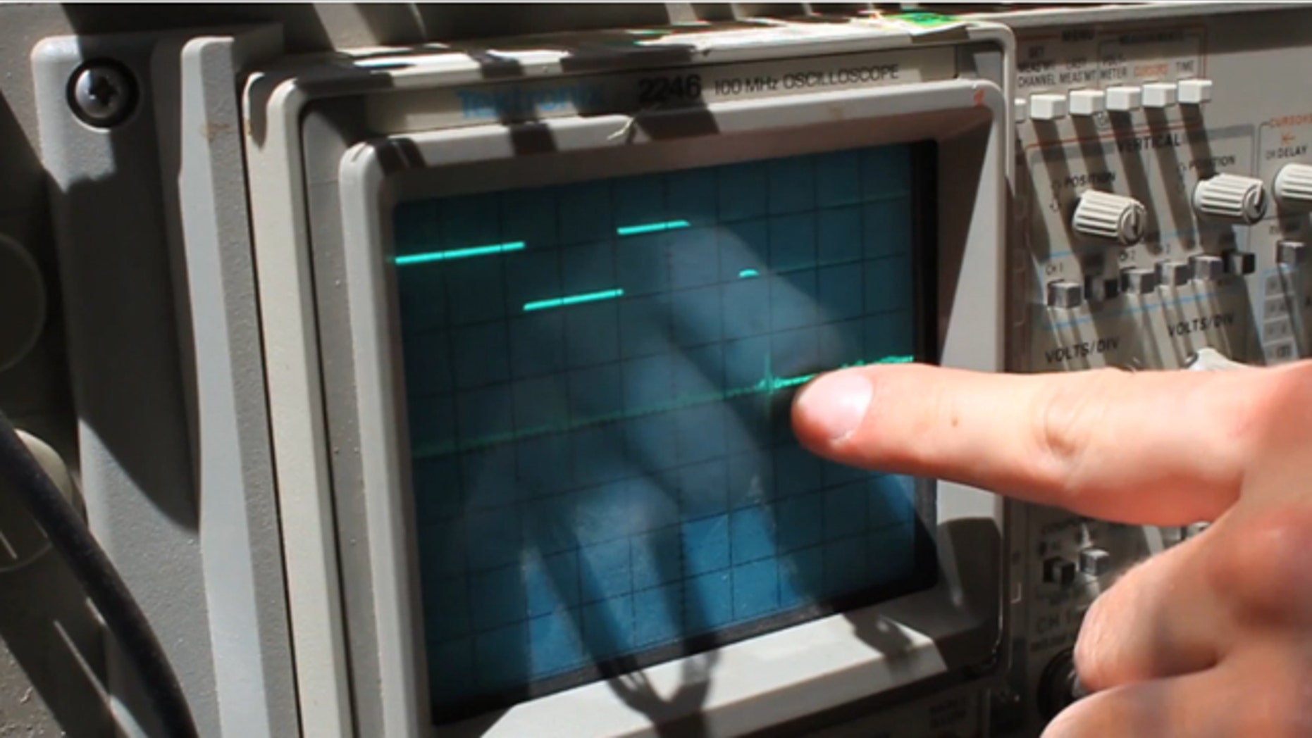 Lincoln Laboratory researcher John Peabody demonstrates how their team's system can see through walls.