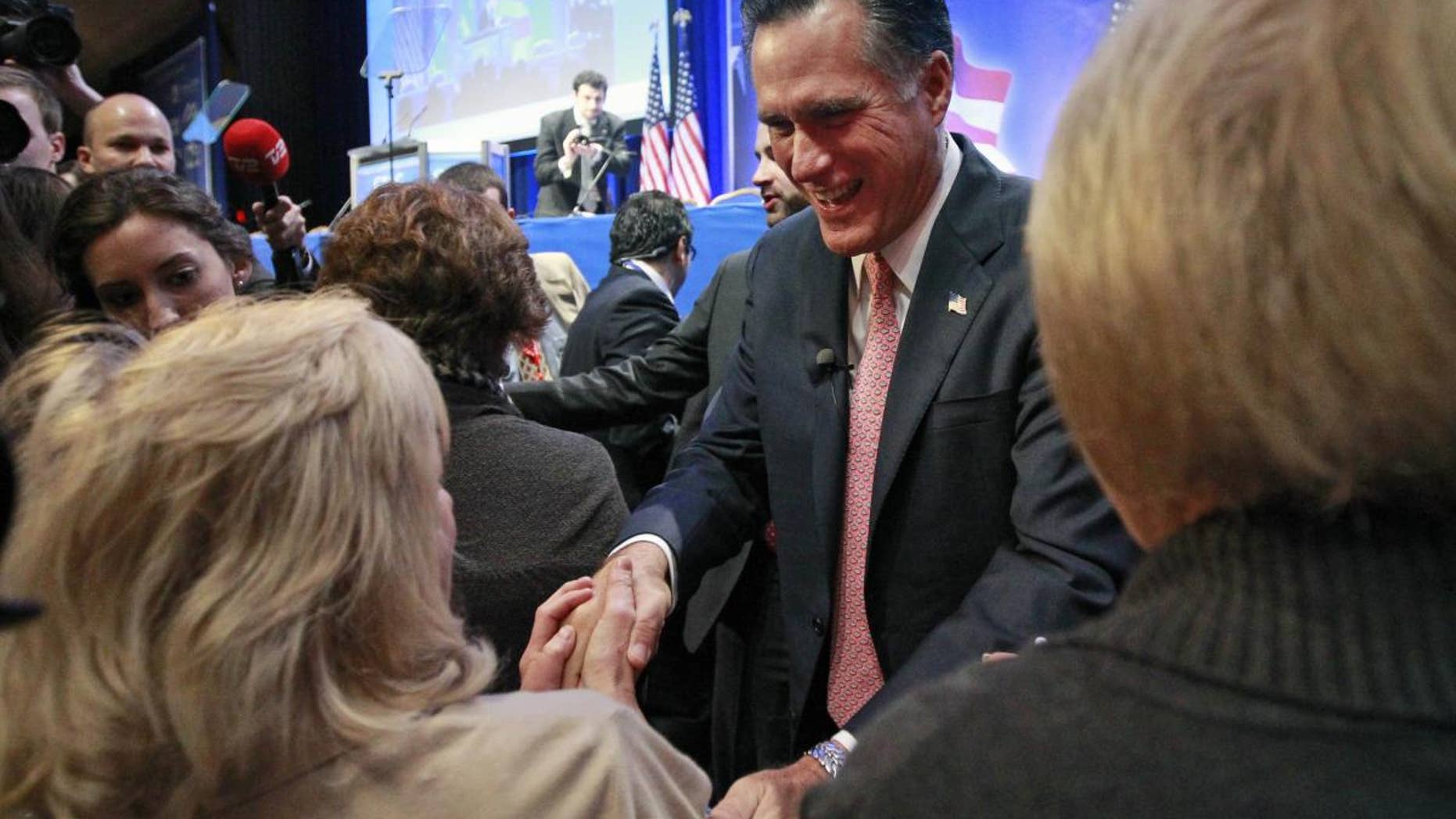 Mitt Romney shakes hands after speaking at the Conservative Political Action Conference (CPAC) in Washington, Friday, Feb. 11, 2011.(AP Photo/Alex Brandon)