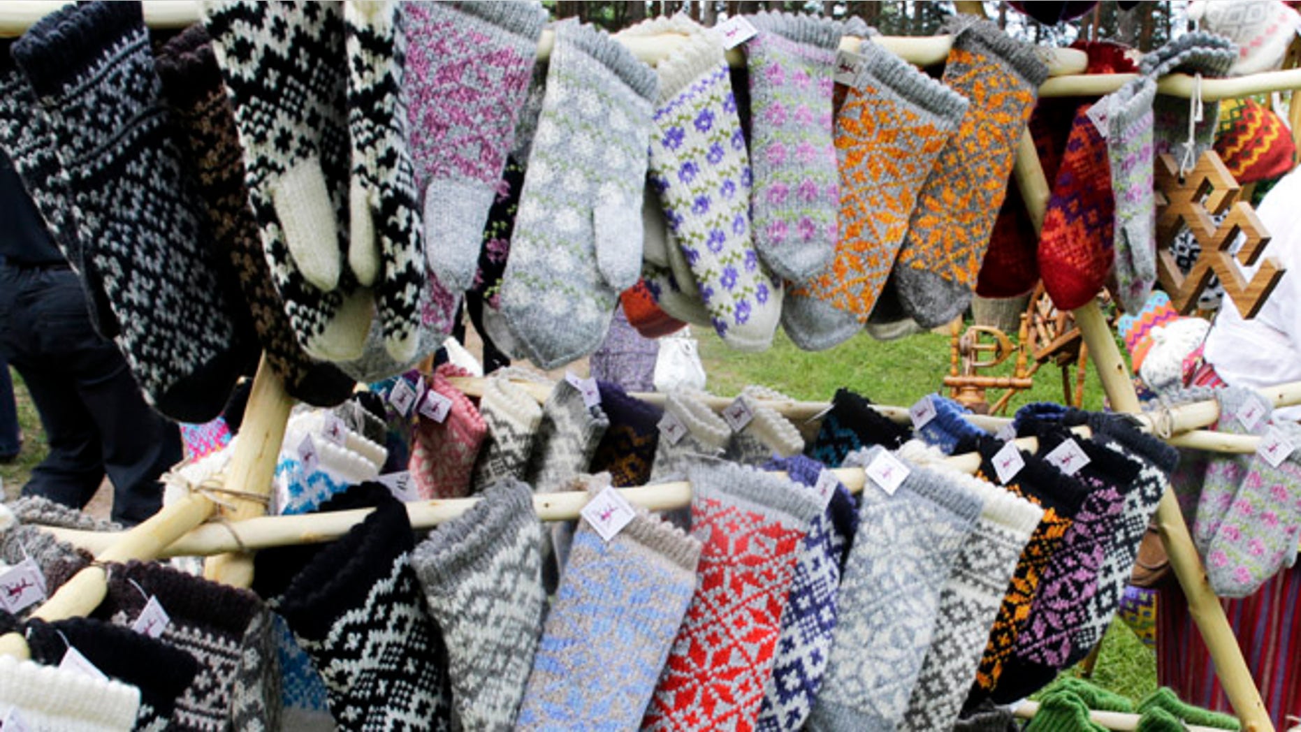 Traditional knitted mittens are displayed during an annual Traditional Applied Arts Fair in the Ethnographic Open-air Museum of Latvia in Riga, June 1, 2013. According to the organisers, the fair has more than 500 tailors, leather craftsmen, wood carvers, jewellery designers, blacksmiths, basket-makers, weavers, potters, as well as knitters from all over Latvia who will be selling their crafts from June 1 to 2. REUTERS/Ints Kalnins (LATVIA - Tags: SOCIETY TRAVEL) - RTX10864