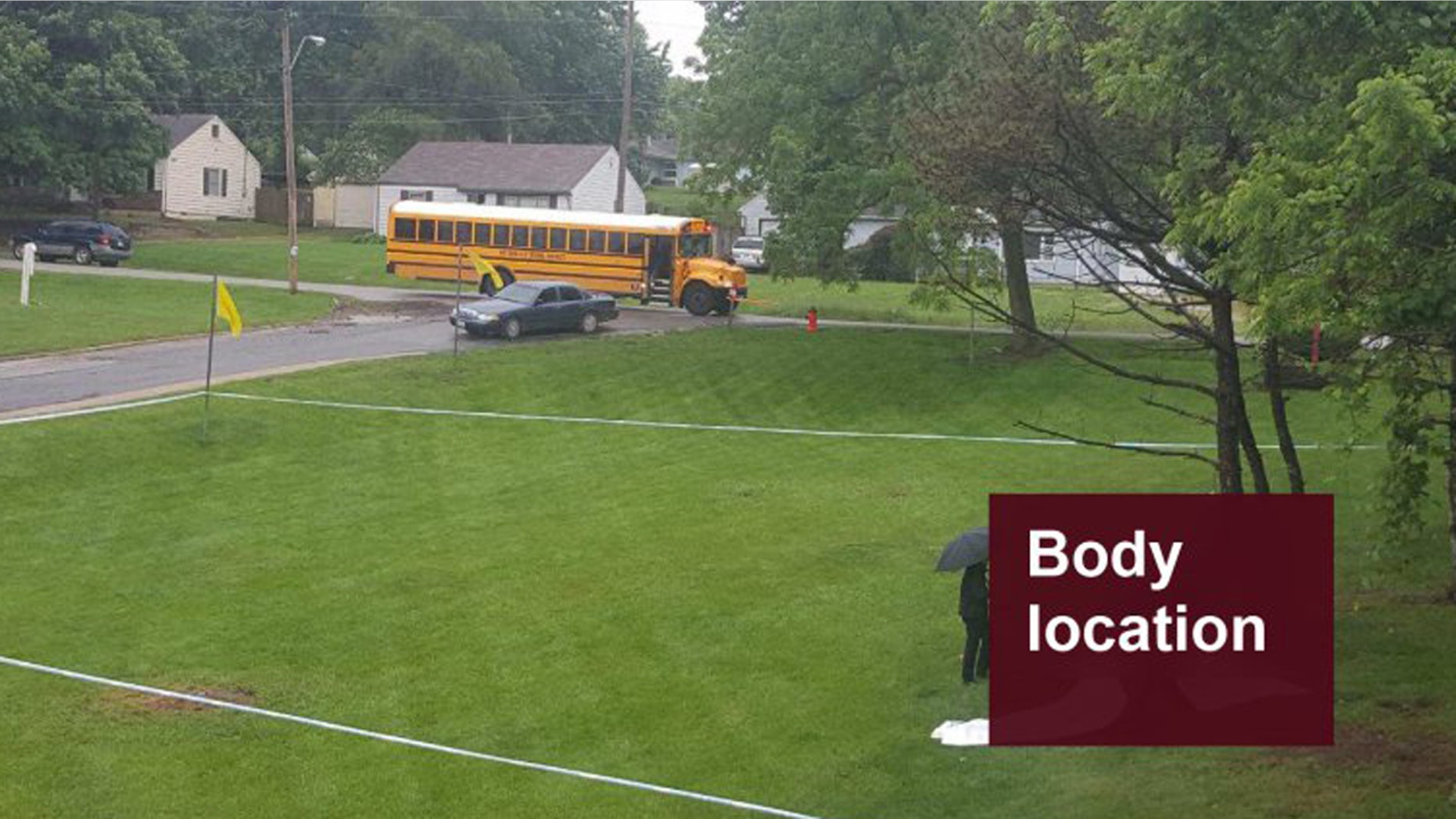 The scene where a body was found in a residential area when the bus of children passed by.