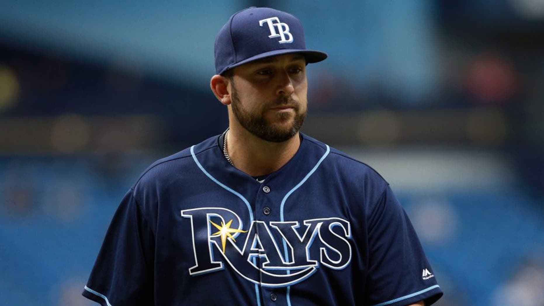Apr 14, 2016; St. Petersburg, FL, USA; Tampa Bay Rays relief pitcher Dana Eveland (51) walks back to the dugout at Tropicana Field. Cleveland Indians defeated the Tampa Bay Rays 6-0. Mandatory Credit: Kim Klement-USA TODAY Sports