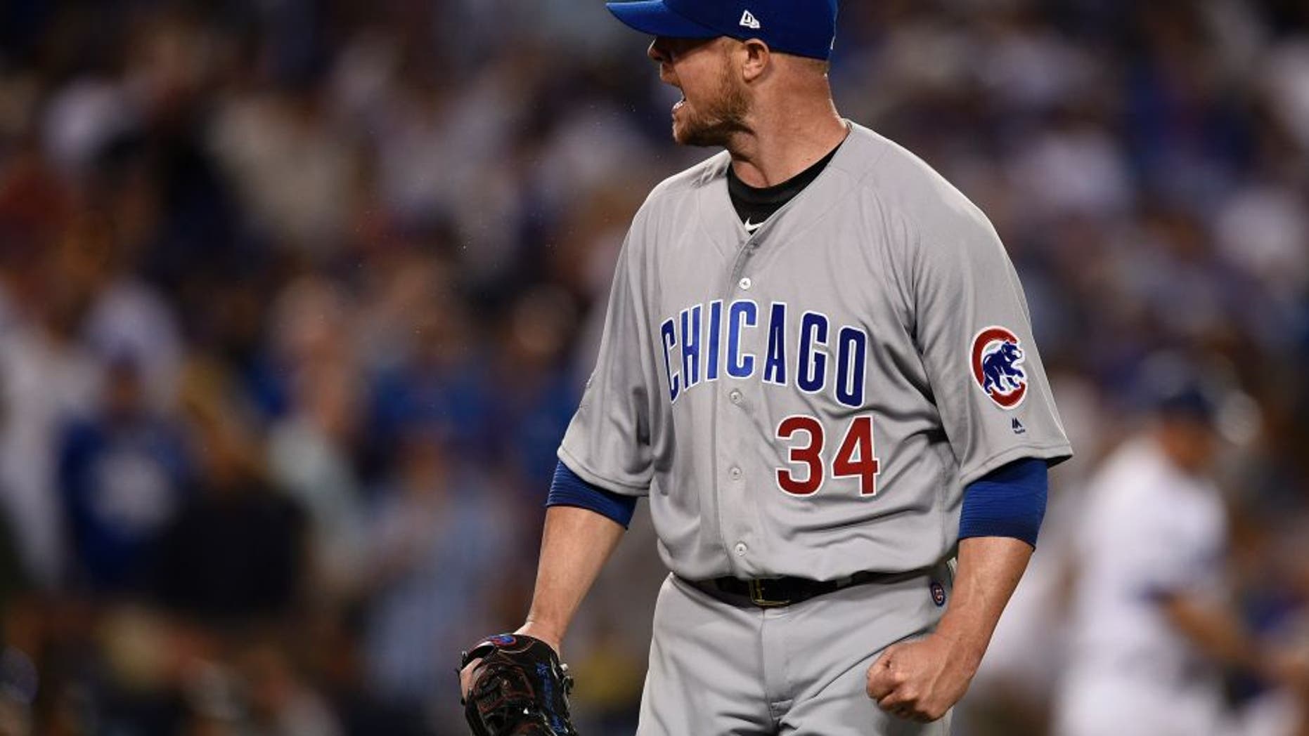 Oct 20, 2016; Los Angeles, CA, USA; Chicago Cubs starting pitcher Jon Lester (34) reacts after the third out in the third inning against the Los Angeles Dodgers in game five of the 2016 NLCS playoff baseball series against the Los Angeles Dodgers at Dodger Stadium. Mandatory Credit: Kelvin Kuo-USA TODAY Sports