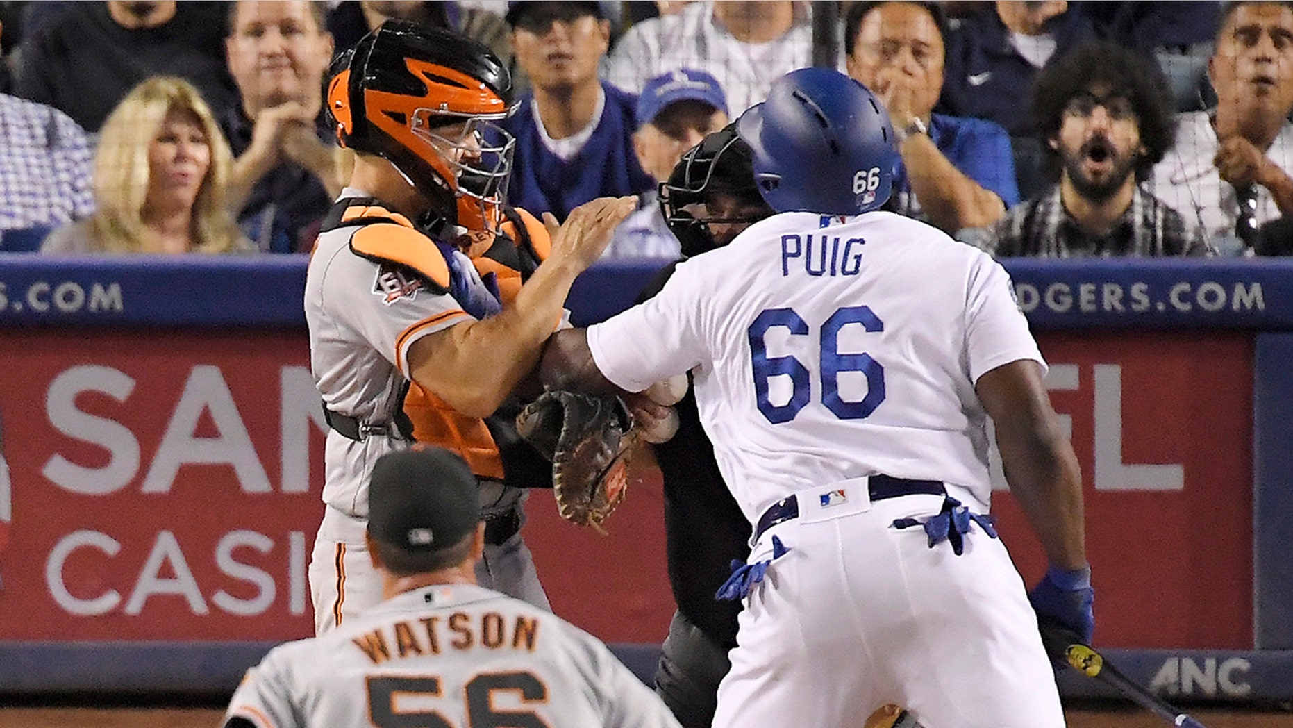 Dodgers outfielder Yasiel Puig, right, and Giants catcher Nick Hundley were involved in a brawl Tuesday.