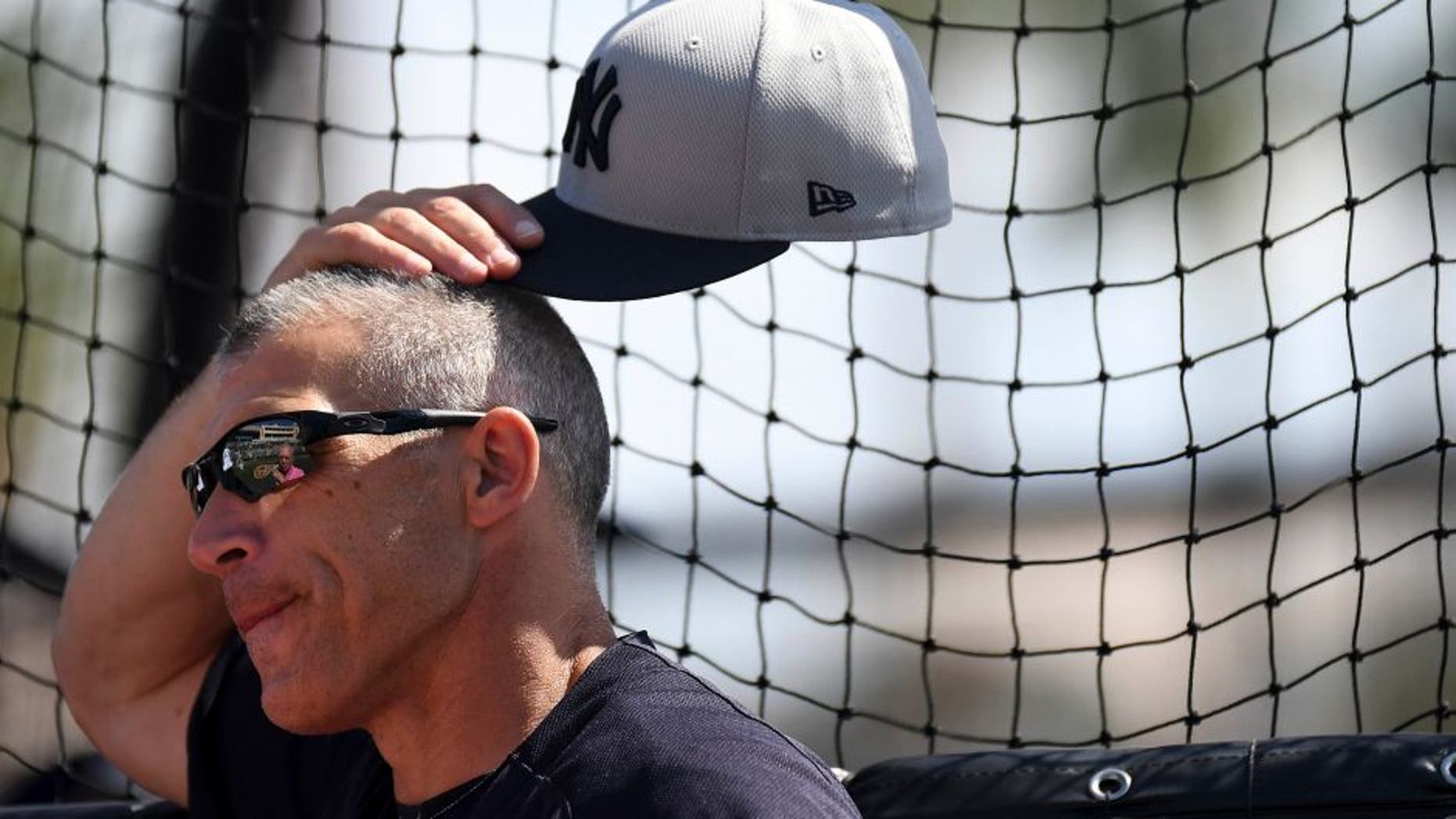 Feb 27, 2017; Sarasota, FL, USA; New York Yankees manager Joe Girardi (28) looks on during batting practice before the start of the spring training game against the Baltimore Orioles at Ed Smith Stadium. Mandatory Credit: Jonathan Dyer-USA TODAY Sports