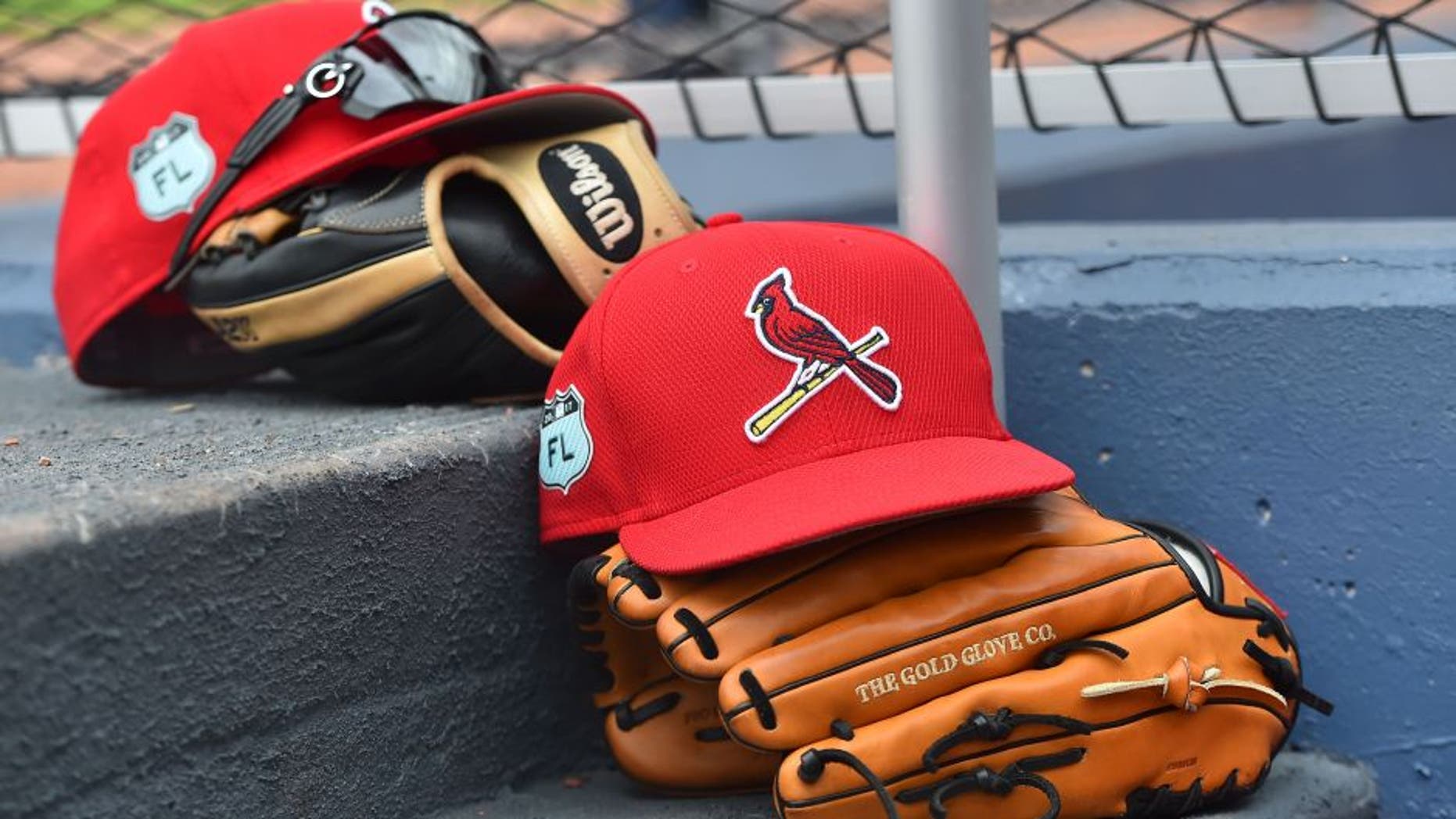 Mar 3, 2017; West Palm Beach, FL, USA; A view of St. Louis Cardinals hats and gloves on the steps of the dugout in the game against the Washington Nationals at The Ballpark of the Palm Beaches. Mandatory Credit: Jasen Vinlove-USA TODAY Sports