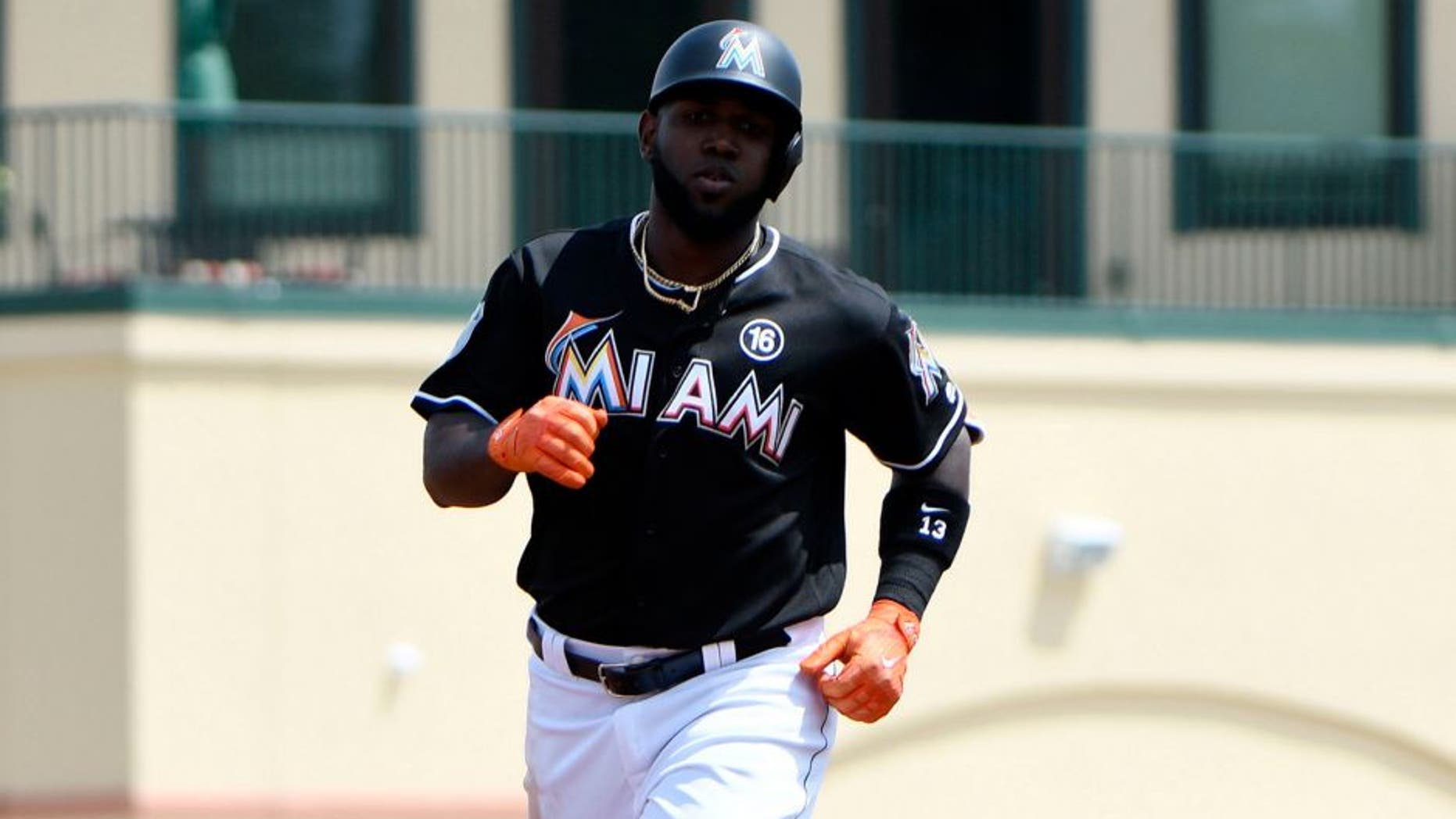 Mar 17, 2017; Jupiter, FL, USA; Miami Marlins center fielder Marcell Ozuna (13) rounds the bases after hitting a three run homer during a spring training game against the Washington Nationals at Roger Dean Stadium. Mandatory Credit: Steve Mitchell-USA TODAY Sports