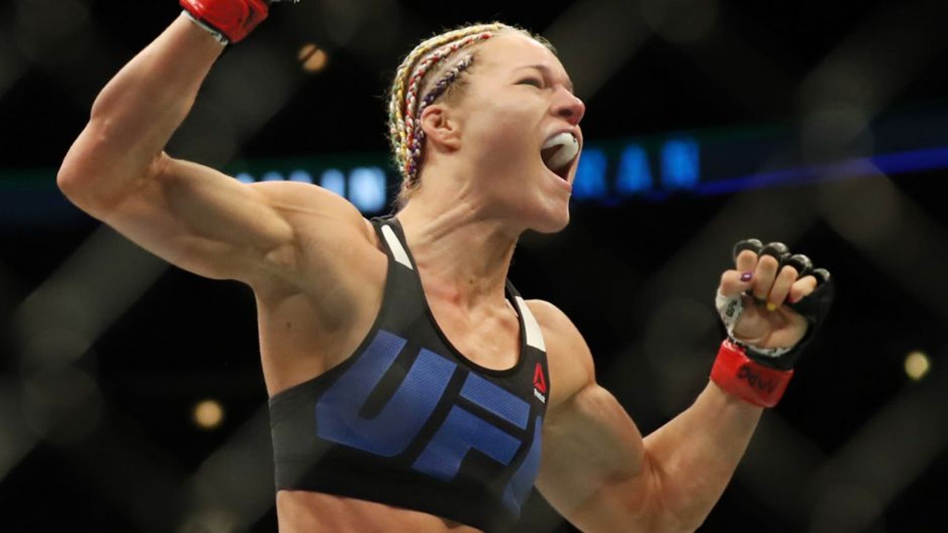 July 23, 2016; Chicago, IL, USA; Felice Herrig (red gloves) celebrates after defeating Kailin Curran (blue gloves) during UFC Fight Night at United Center. Mandatory Credit: Kamil Krzaczynski-USA TODAY Sports