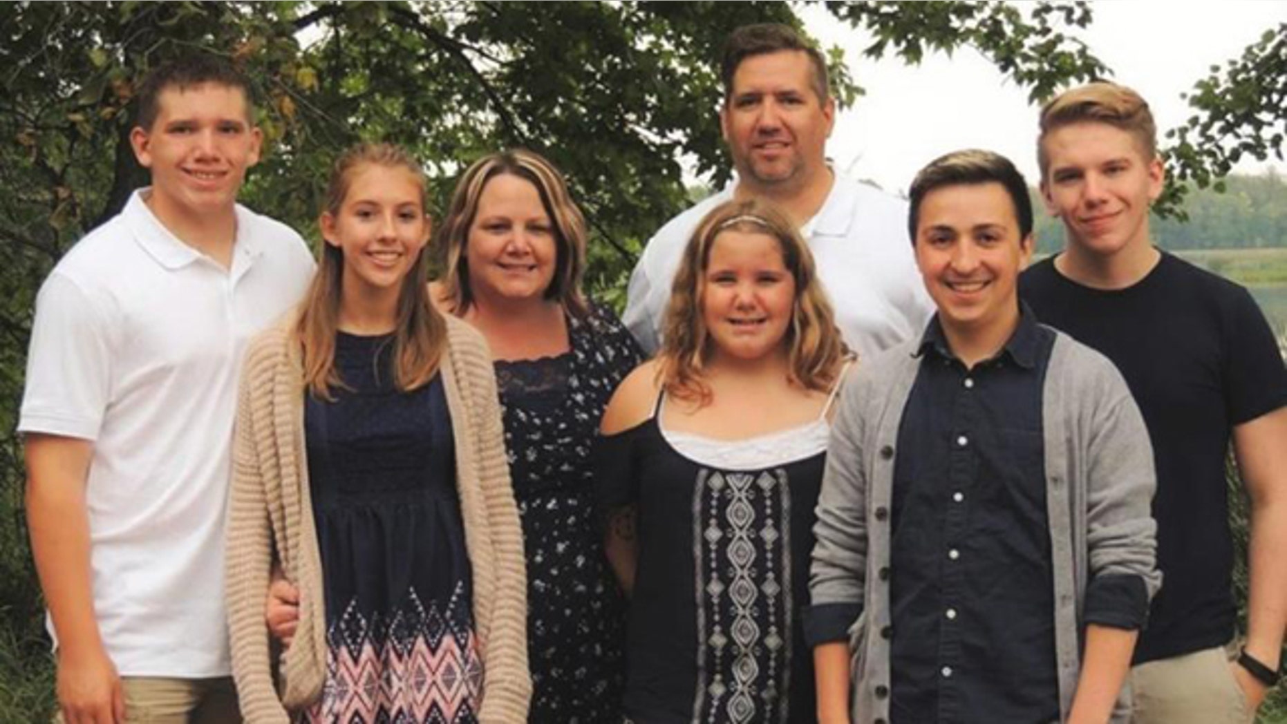 This undated photo shows the Peterson family of Ada, Minn. Carter Peterson, far left, was killed in a car crash that Randy, third from right, responded to as a volunteer firefighter