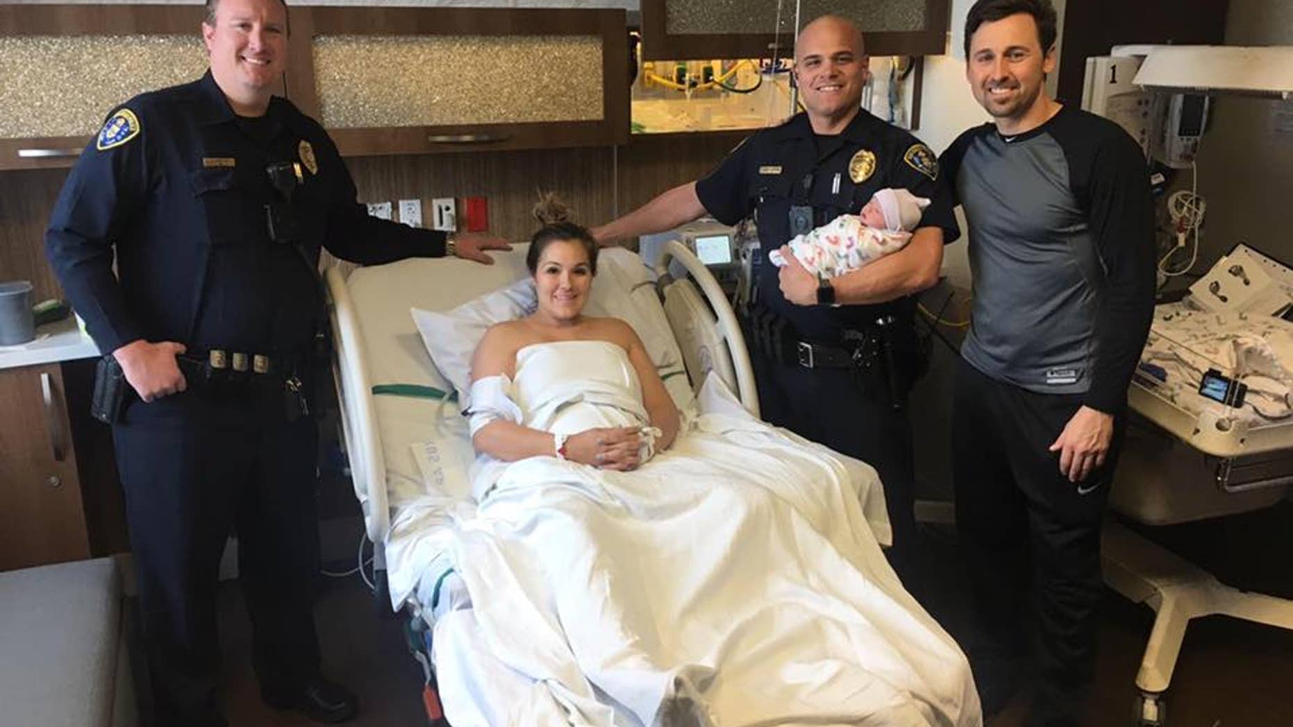 Officers helped deliver the healthy baby in the post office parking lot.