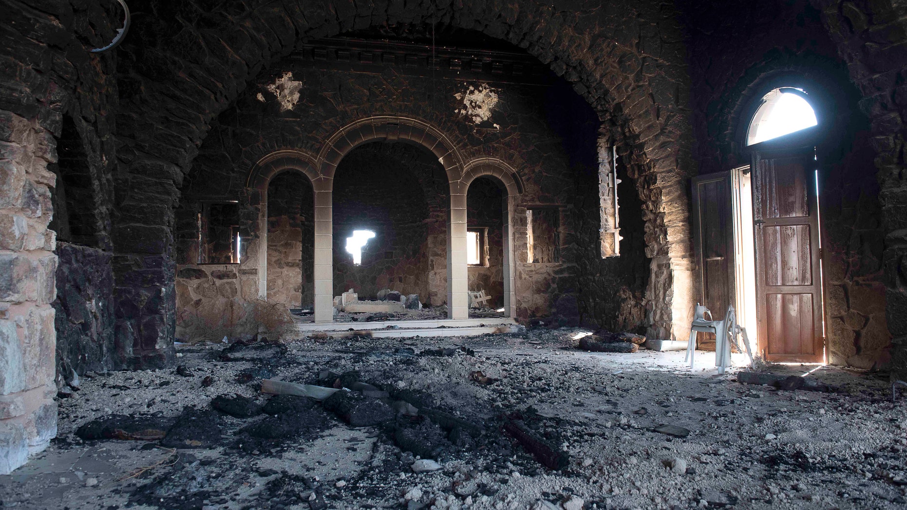 Mar Elian monastery appears ravaged after heavy fighting between Syrian Army and the Islamic State group in Qaryatain, Syria, Monday, April 4, 2016. (AP Photo/Natalia Sancha)