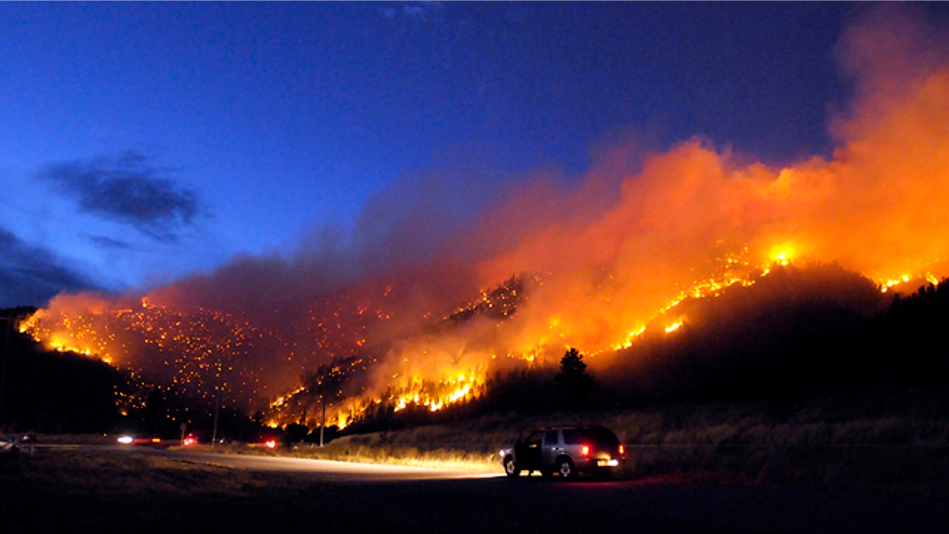 Aug. 22: Flames light up the evening sky near Missoula, Mont., as a wildfire burns through timber.