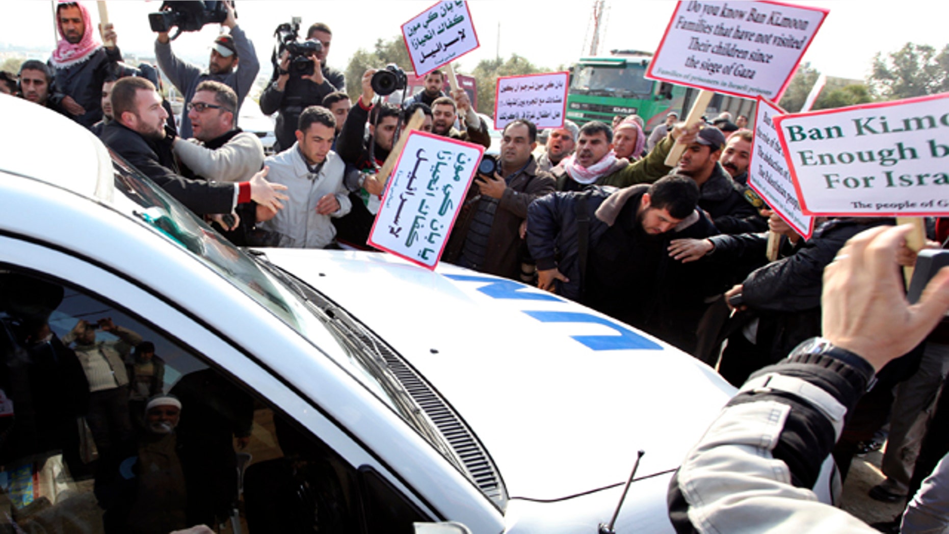 Feb. 2: Palestinian protesters surround a vehicle in the convoy of U.N. Secretary-General Ban Ki-moon as it arrives at Erez border crossing between Israel and Gaza.
