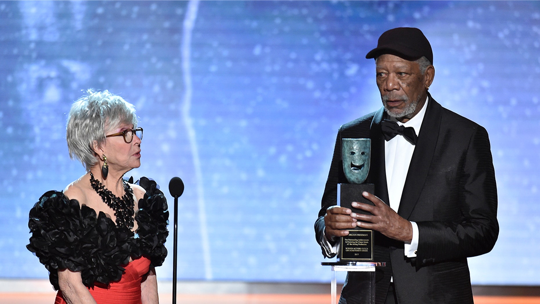 Rita Moreno, left, looks on as Morgan Freeman accepts the Life Achievement Award at the 24th annual Screen Actors Guild Awards at the Shrine Auditorium & Expo Hall on Sunday, Jan. 21, 2018, in Los Angeles. (Photo by Vince Bucci/Invision/AP)