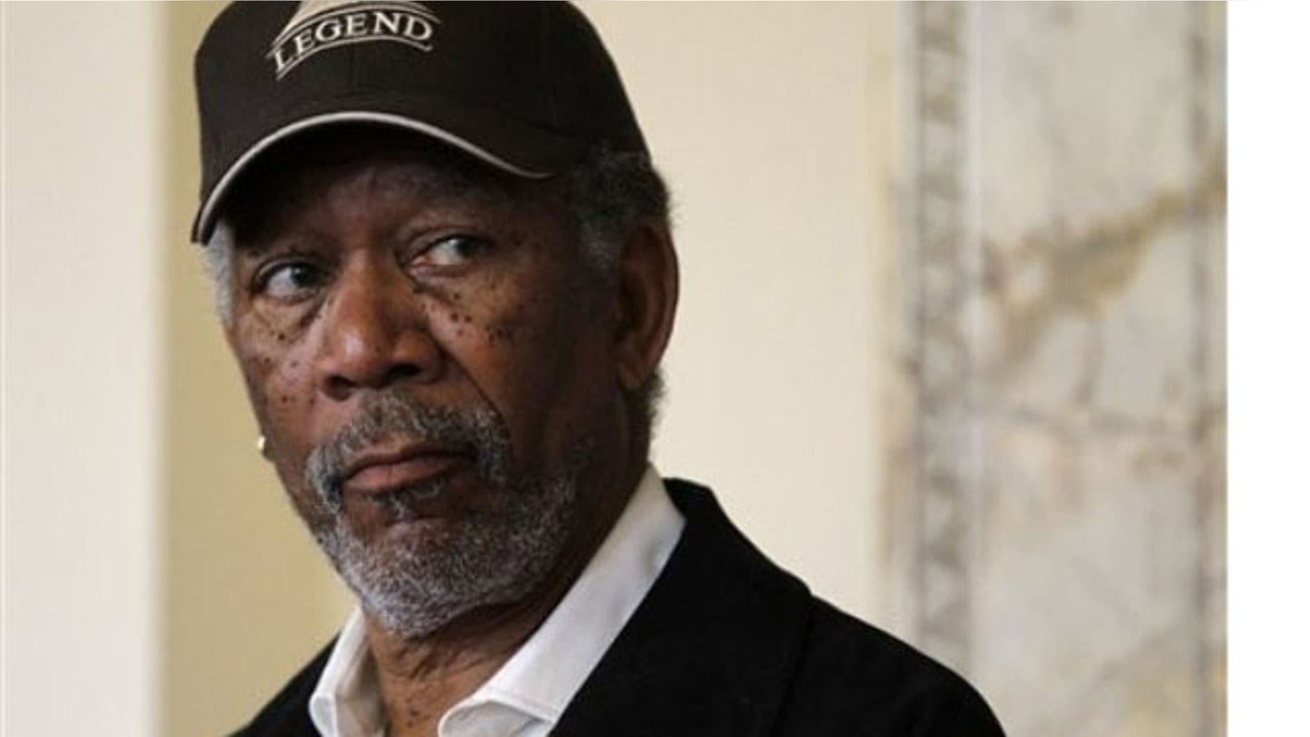 Actor Morgan Freeman listens during a news conference at Symphony Hall, in Boston, Tuesday, May 18, 2010.