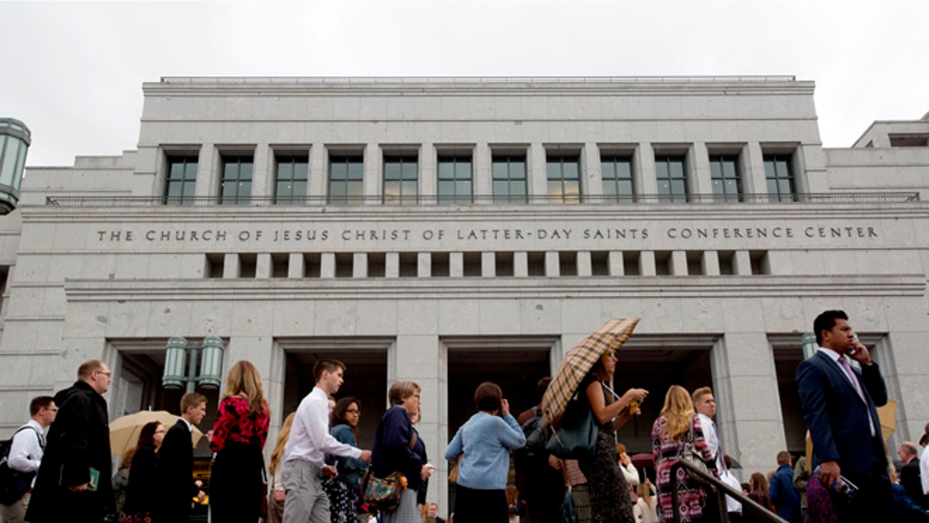 People arrive for the opening session of the two-day Mormon church conference at the LDS Conference Center, Saturday, Oct. 3, 2015, in Salt Lake City. As many as three new high-ranking Mormon leaders could be named during the weekendâs church conference to fill vacancies on a governing body that sets church policy and run the faithâs business operations. (AP Photo/Kim Raff)