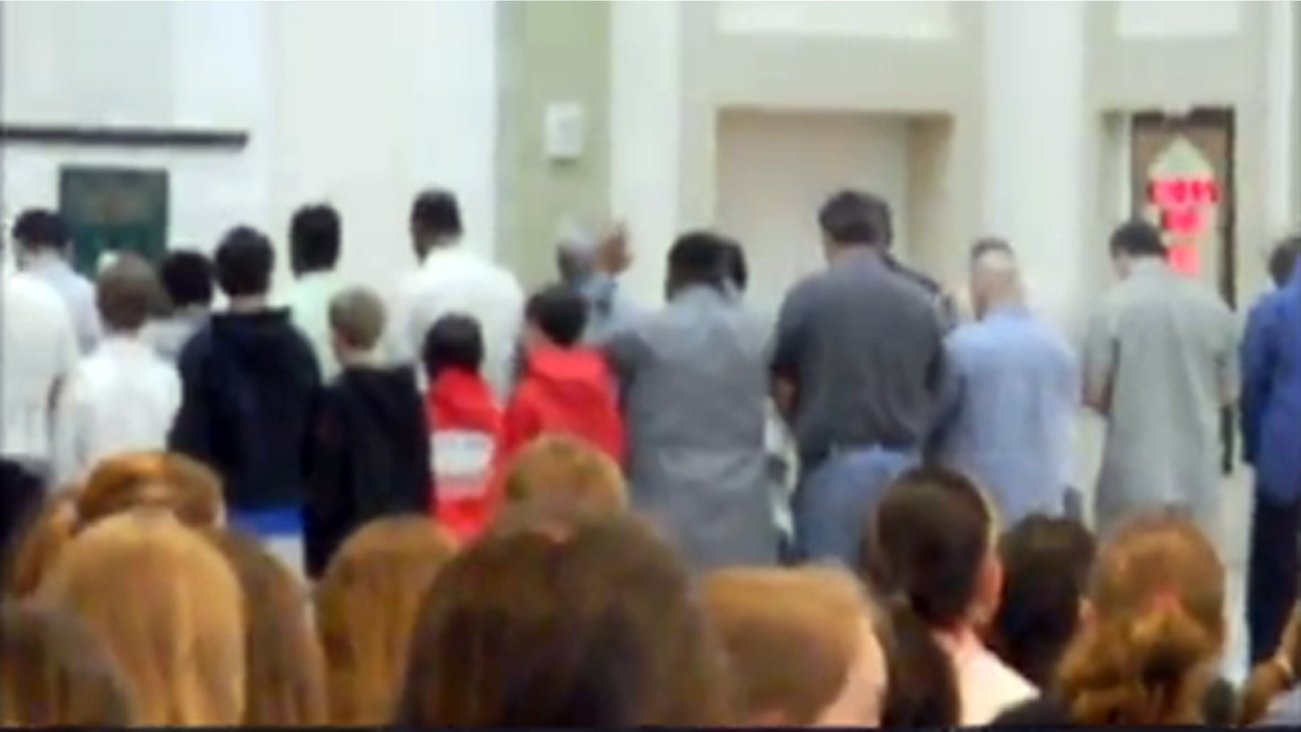 May 27, 2010: Video shot by a parent during a Wellesley Middle School field trip shows five sixth-grade boys, left, engaging in a prayer ritual at Islamic Society of Boston Community Center.