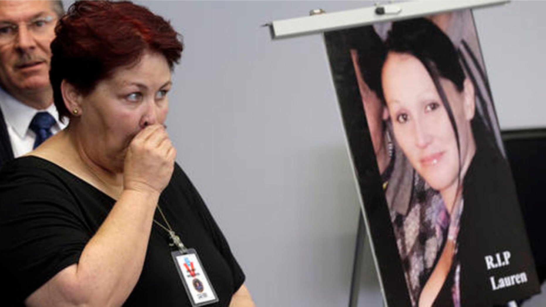 Jerilyn Olguin, mother of murder victim Lauren Elaine Olguin, seen in the photo, appears at a FBI news conference announcing additions to its 10 Most Wanted list, in Los Angeles Thursday, May 19, 2016. Fugitive Philip Patrick Policarpio is suspected in the shooting death of his pregnant girlfriend, Lauren Olguin, on April 12, 2016 in Los Angeles, has been added to the FBI's 10 Most Wanted list.(AP Photo/Nick Ut)
