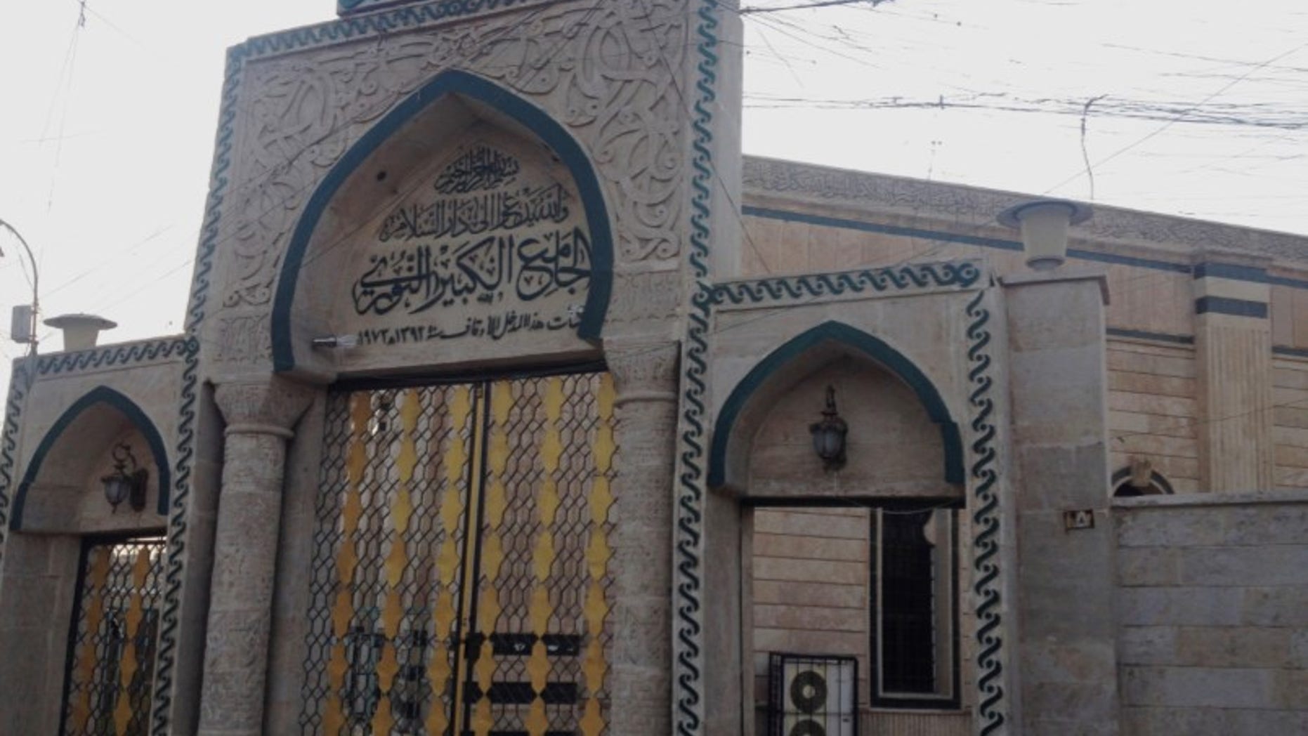 In this 2014 file photo, the gate of the Great Mosque or al-Nuri Mosque is seen in the northern city of Mosul, Iraq. The Islamic State group destroyed Mosul’s al-Nuri mosque and its iconic leaning minaret late Wednesday night when fighters detonated explosives inside the structures, according to Iraq’s Ministry of Defense.