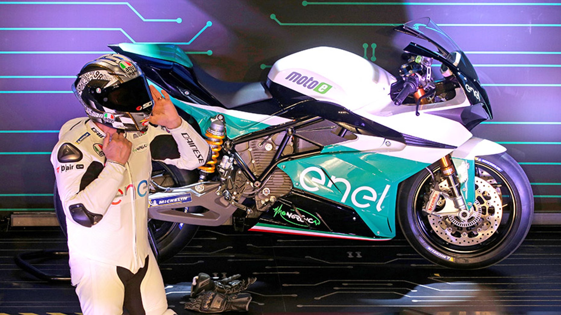 Former MotoGP rider Loris Caprirossi unveils MotoE's Energica Ego racing bike.