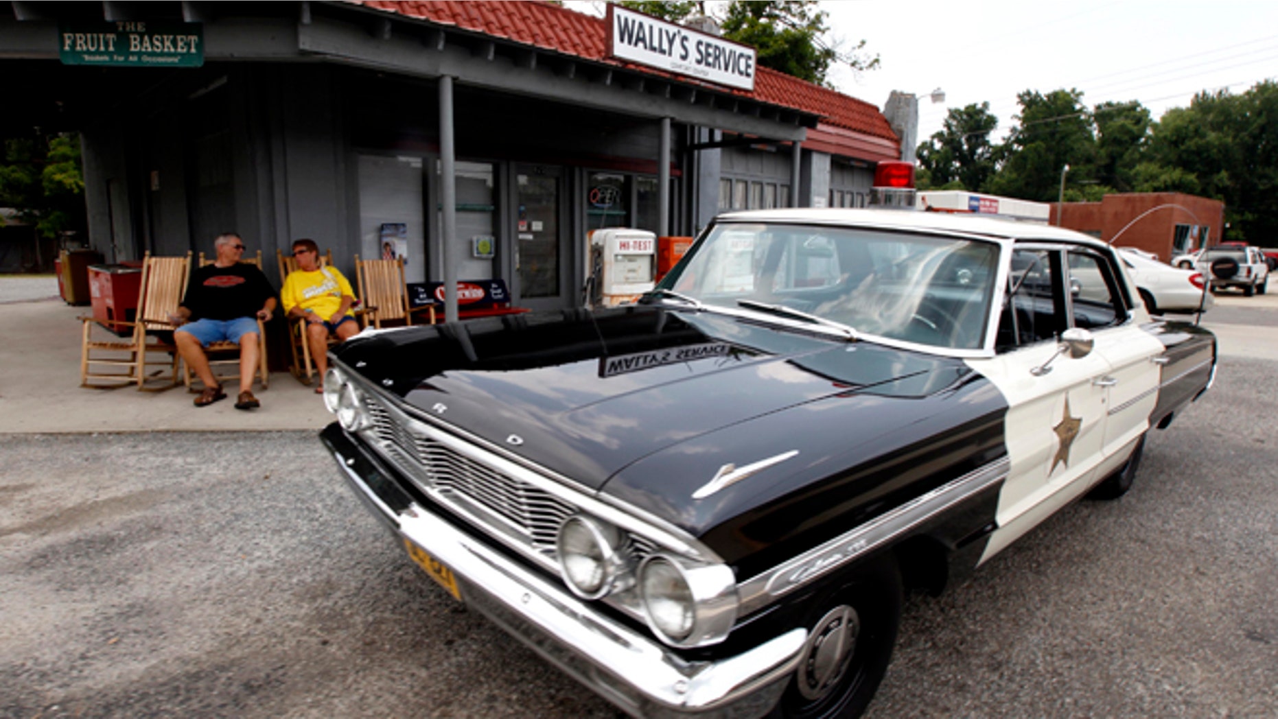 July 3, 2012: Mike and Terry Jones sit outside Wally's Service, a replica of the Andy Griffith Show, in Mount Airy, N.C.