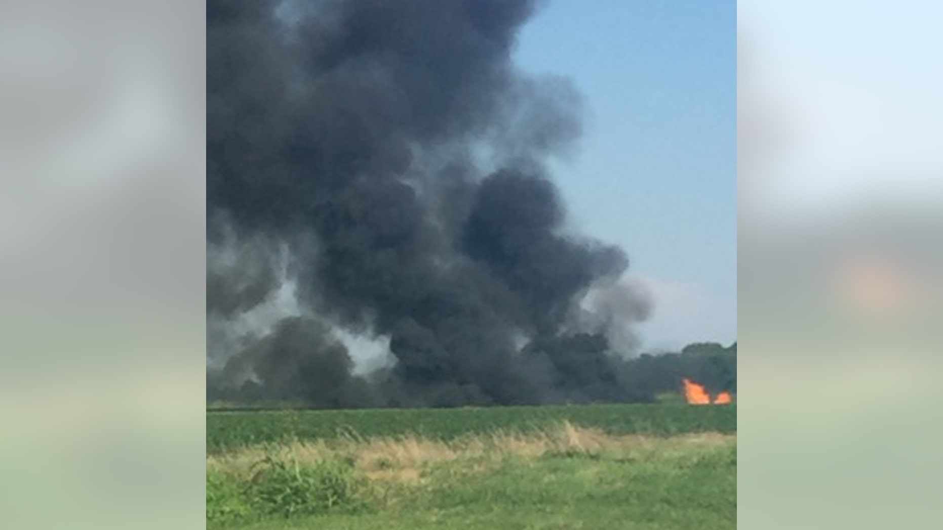 Smoke rises from the site where a Marine KC-130 refueling plane crashed in Leflore County, Miss., Monday evening.