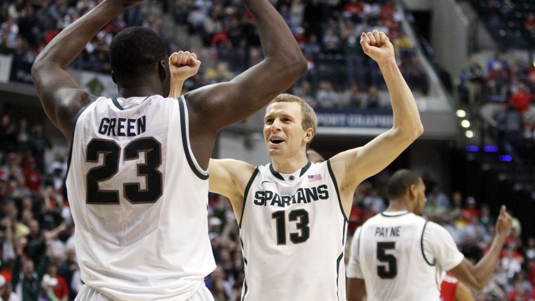 March 11, 2012: Michigan State forward Draymond Green (23) and guard Austin Thornton (13) celebrate after an NCAA college basketball game against Ohio State in the final of the Big Ten Conference men's tournament in Indianapolis. Michigan State won 68-64.