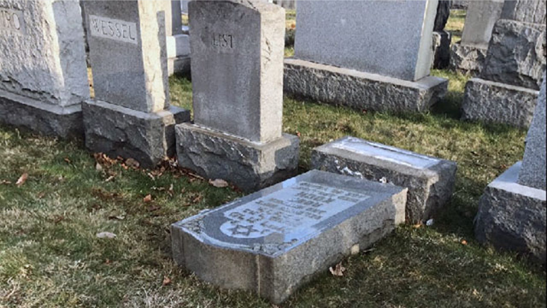 Feb. 26, 2017: The tombstone of a Jewish person lies on the ground at Mount Carmel Cemetery in Frankford, Pa.
