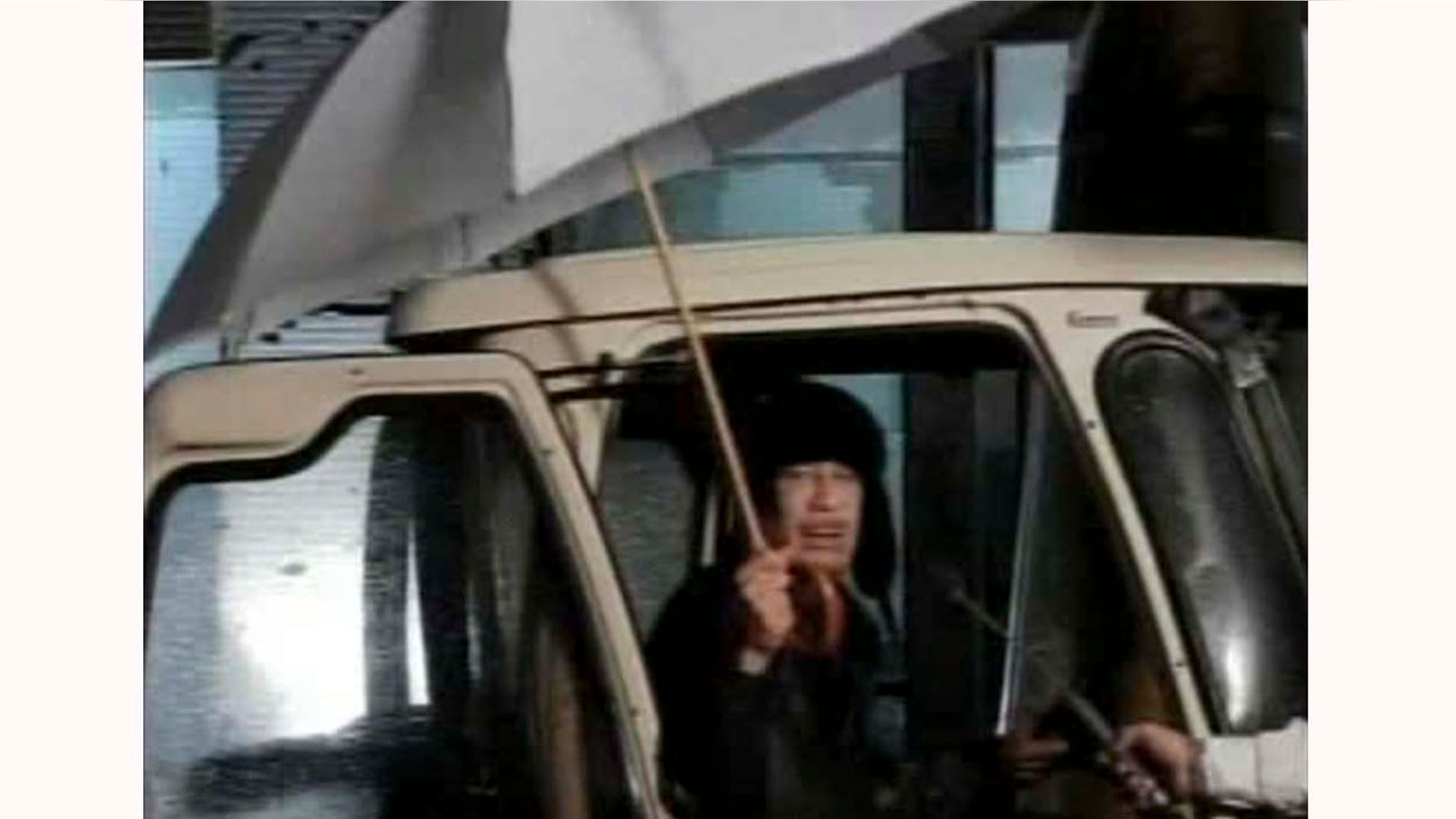 Feb. 22, 2011: This video image broadcast shows Moammar al-Qaddafi making brief remarks to deny rumors that he fled to Venezuela.