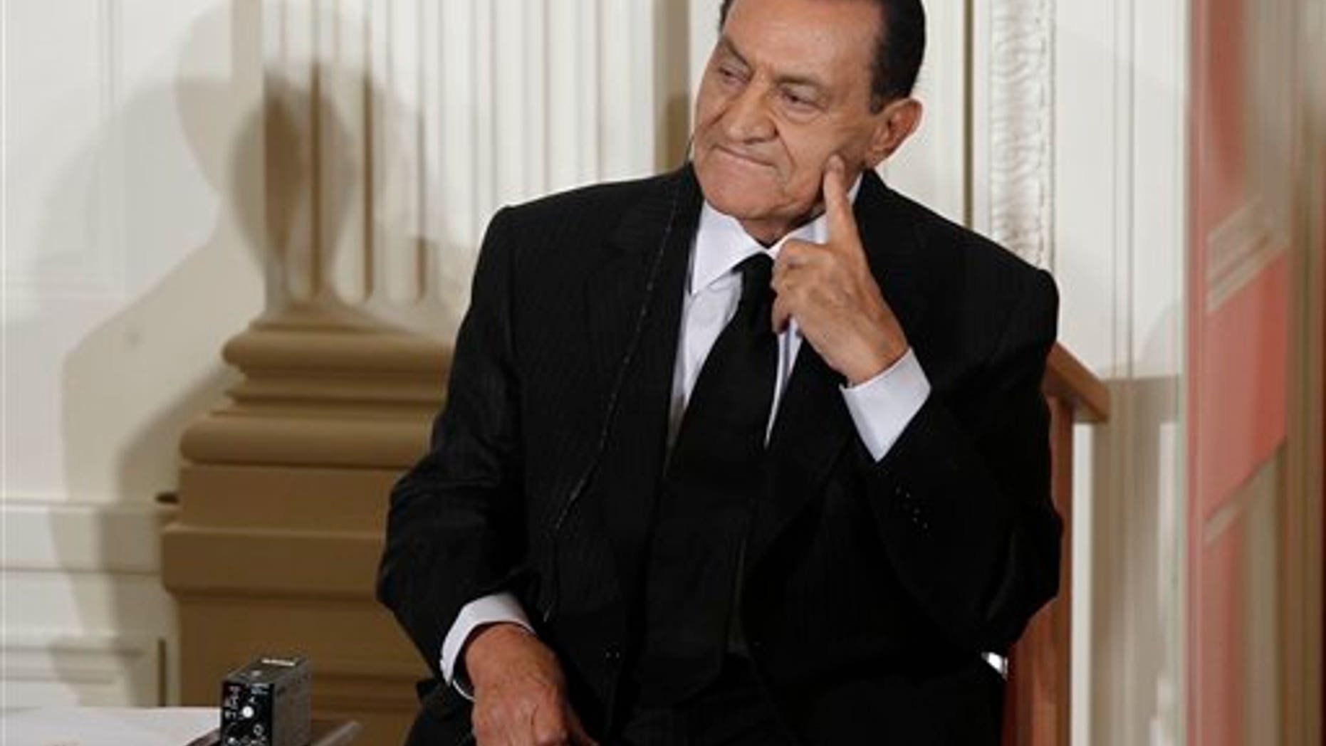In this Sept. 2010 file photo, Egypt's President Hosni Mubarak listens as Israel's Prime Minister Benjamin Nethanyahu, unseen, speaks in the East Room of the White House in Washington.