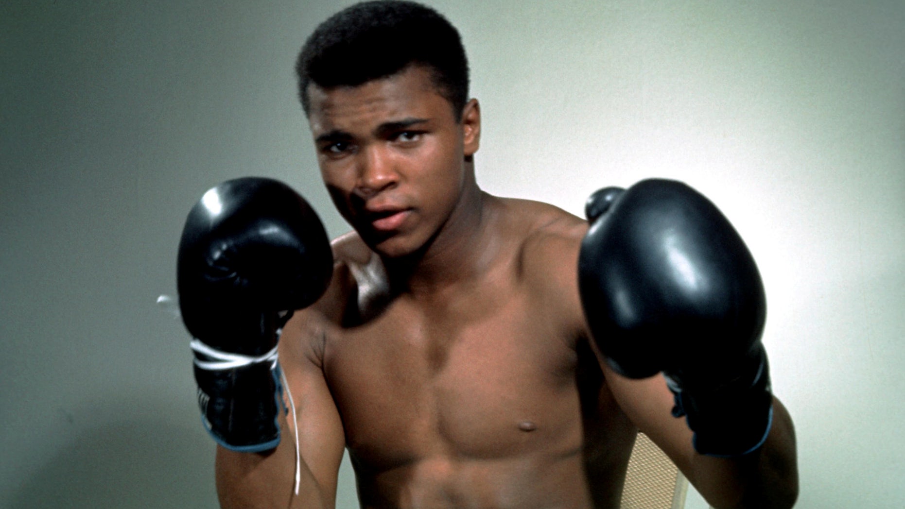 Muhammad Ali poses with gloves in this undated portrait.Mandatory Credit: Action Images / Sporting Pictures/File Photo EDITORIAL USE ONLY. - RTSFZ2A