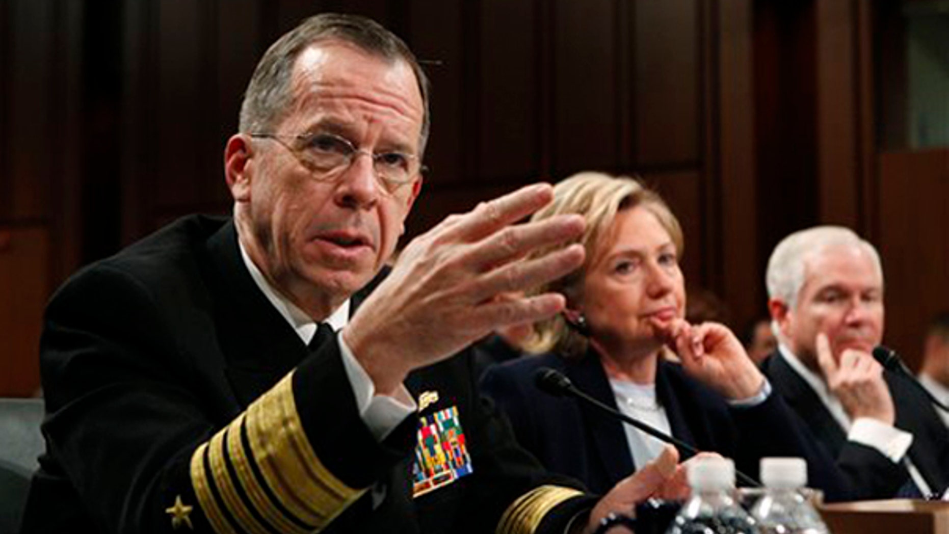 Joint Chiefs Chairman Adm. Michael Mullen, left, testifies on Capitol Hill Dec. 3, as Secretary of State Hillary Clinton and Defense Secretary Robert Gates look on. (AP Photo)