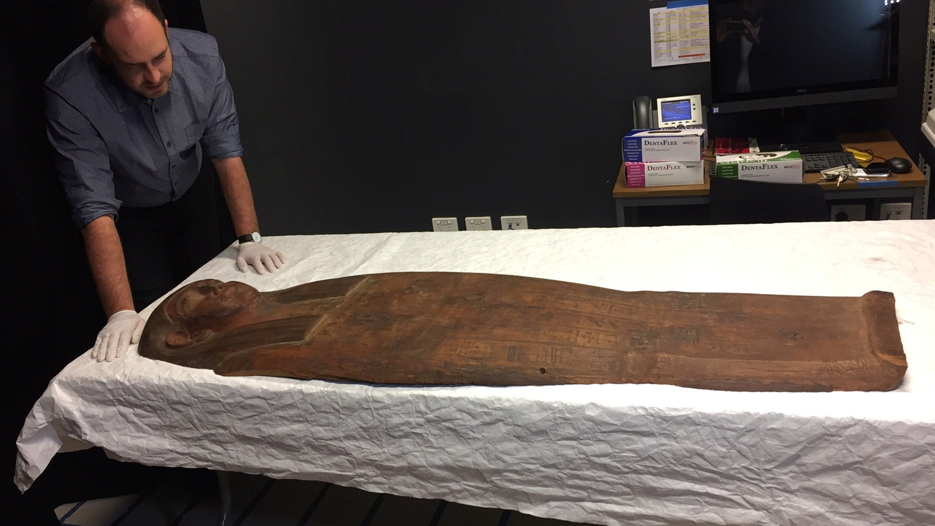 A 2,500-year old coffin that may contain a mummy lies at the University of Sydney in Sydney, Australia March 27, 2018. (REUTERS/Colin Packham)