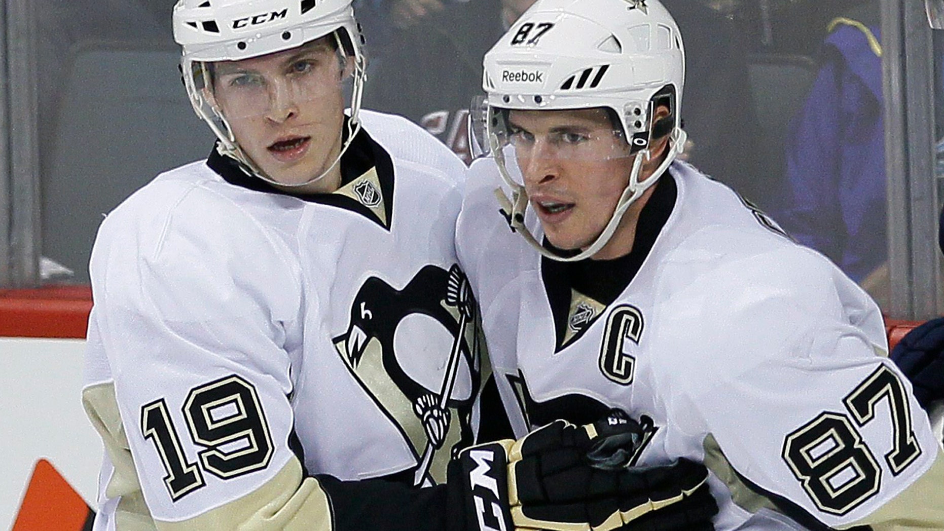 April 3, 2014: This file photo showing Pittsburgh Penguins' Beau Bennett (19) and Sidney Crosby (87) after a goal by Bennett against the Winnipeg Jets during the first period of an NHL hockey game in Winnipeg, Manitoba.