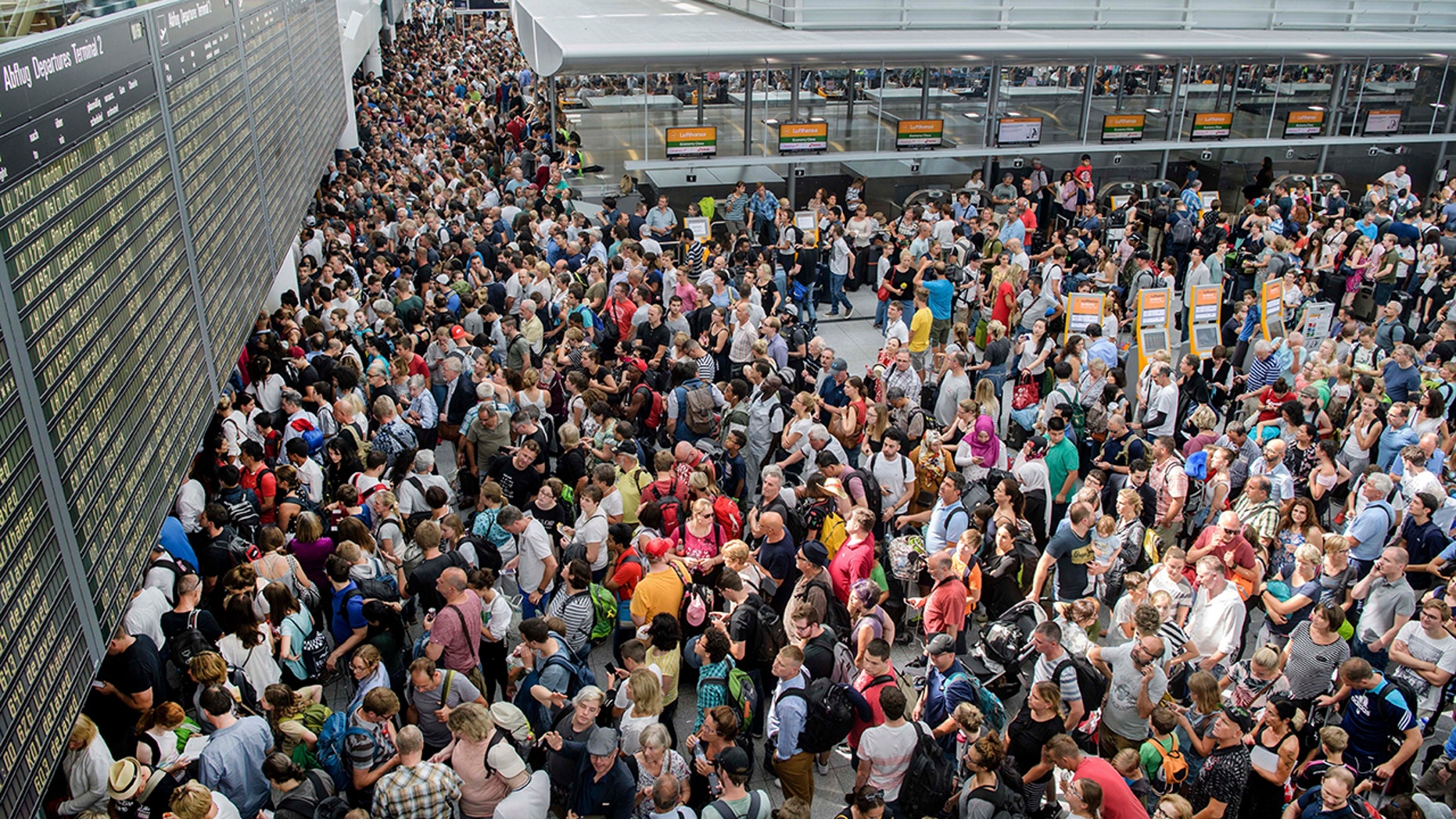 German authorities say they temporarily shut down parts of Munich airport because a woman entered a security zone without going through the security and passport controls.