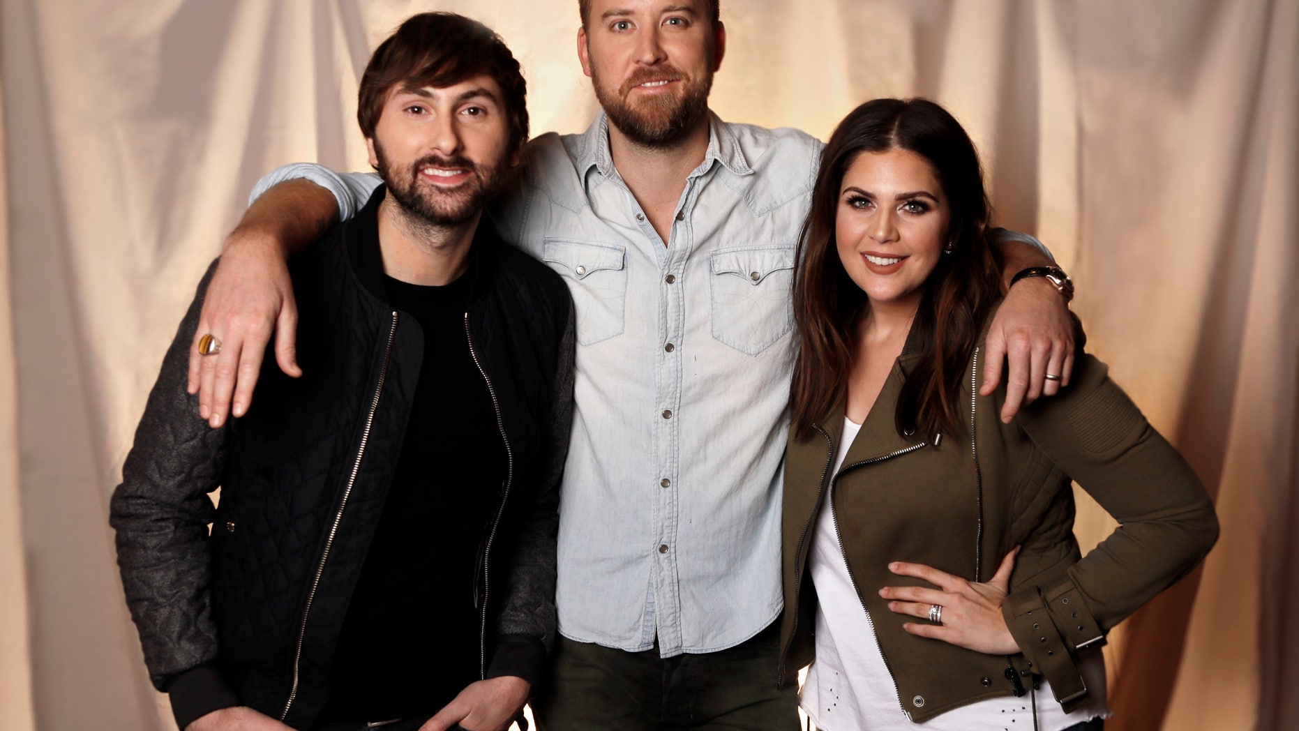 In this Jan. 9, 2017, photo, the members of Lady Antebellum, from left, Dave Haywood, Charles Kelley and Hillary Scott pose in Nashville, Tenn.