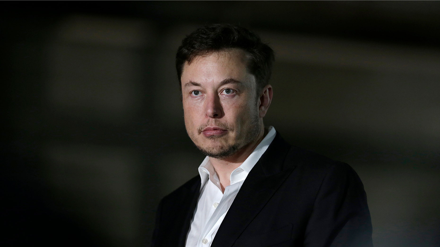 FILE- In this June 14, 2018, file photo, Tesla CEO and founder of the Boring Company Elon Musk speaks at a news conference in Chicago. Tesla is suing a former employee at its Nevada battery factory alleging that he hacked into the manufacturing computers and disclosed confidential trade secrets. The federal lawsuit filed Wednesday, June 20, contends that Martin Tripp of Sparks, Nev., also made false claims to the media about information he stole, including claims that the company used punctured battery cells in the Model 3 electric car. (AP Photo/Kiichiro Sato)