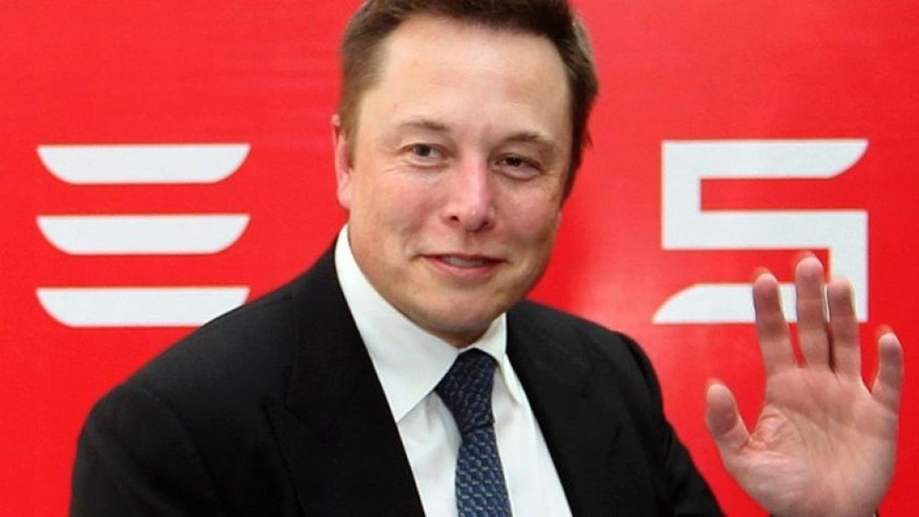 Tesla Chief Executive Elon Musk stands on the podium as he attends a forum on startups in Hong Kong, China January 26, 2016. (REUTERS/Bobby Yip)