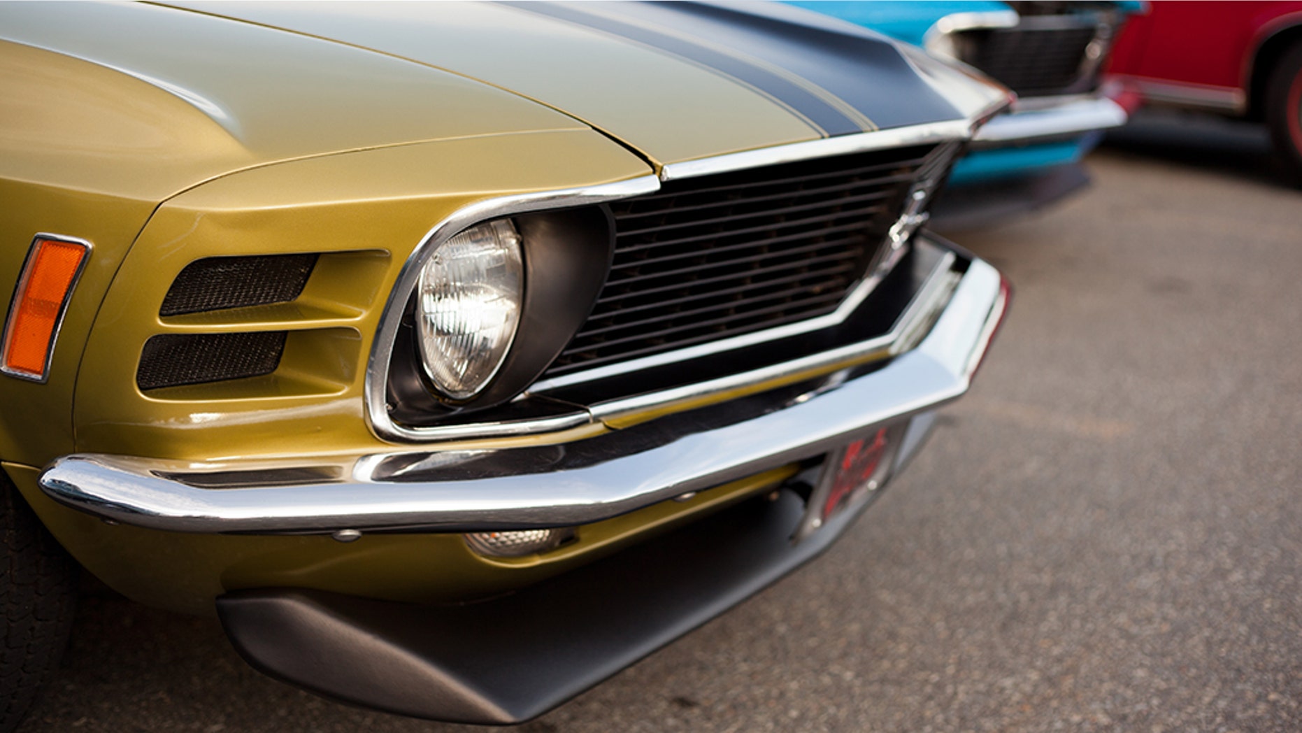 "Dartmouth, Nova Scotia Canada - July 19, 2012: A front end shot of a 1970 Ford Mustang antique car in Dartmouth, Nova Scotia, Canada. This classic car was parked by the owner in a parking lot at a local weekly gathering with other classic cars and car enthusiasts."