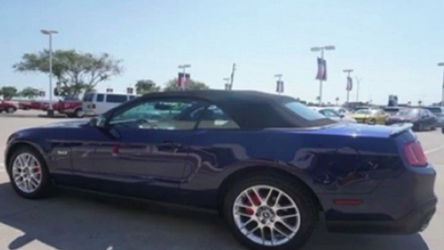 A Florida woman's Mustang convertible was stolen after she stopped to help victims of a car crash.