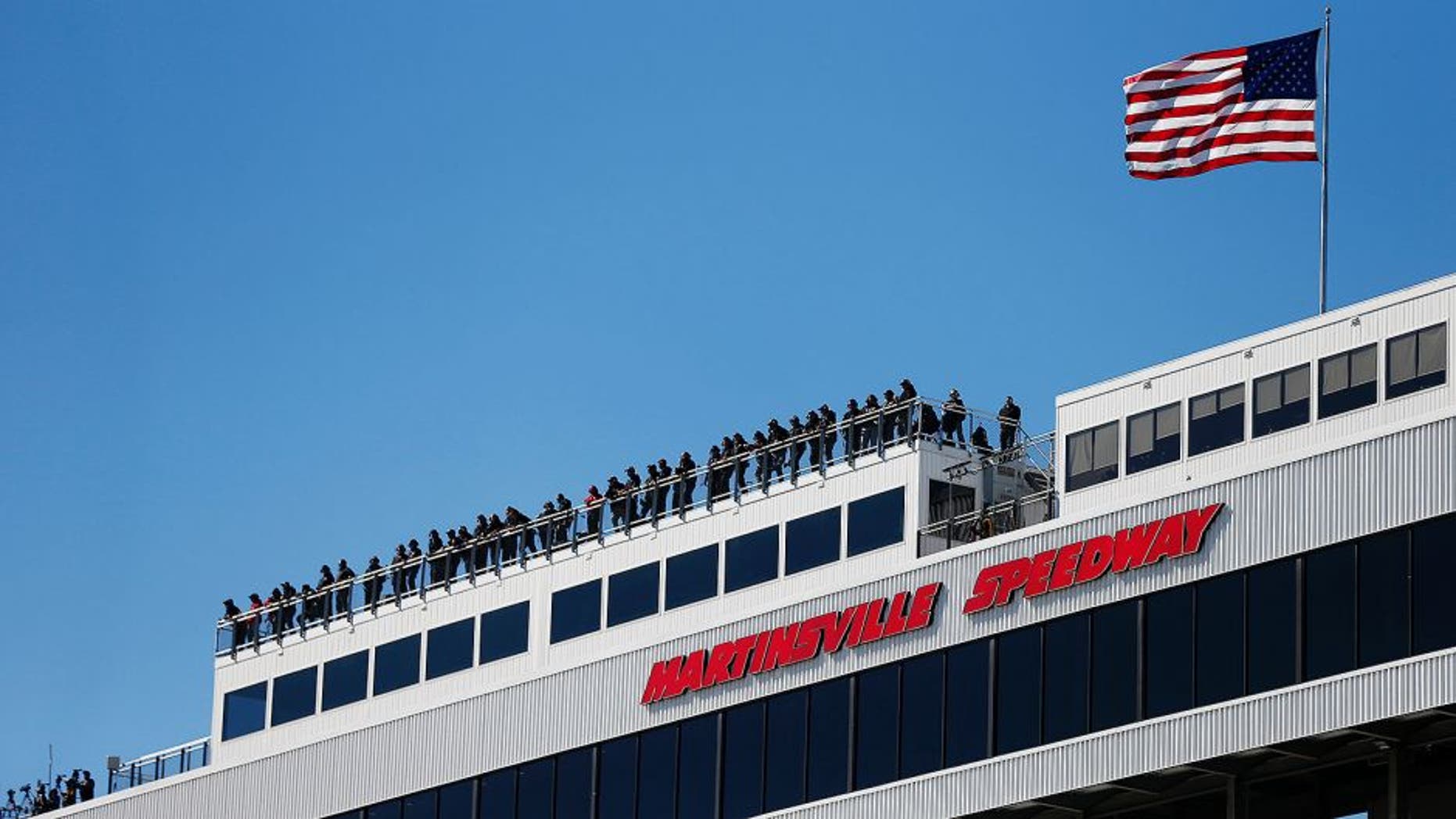 MARTINSVILLE, VA - OCTOBER 30: A general view of spotters on the roof during practice for the NASCAR Camping World Truck Series Kroger 200 at Martinsville Speedway on October 30, 2015 in Martinsville, Virginia. (Photo by Brian Lawdermilk/NASCAR via Getty Images)