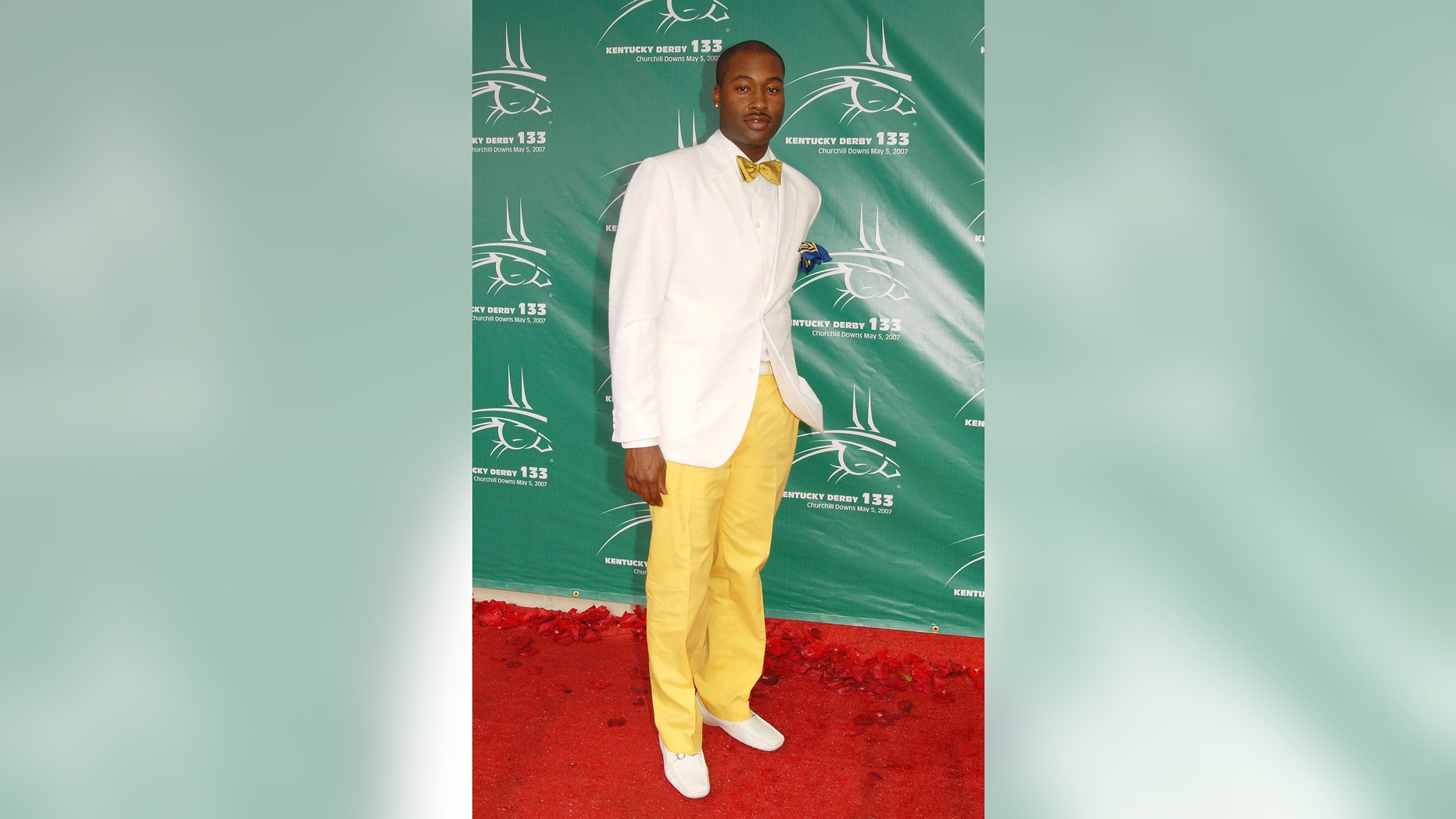 FILE - In this May 5, 2007 file photo, Mychael Knight arrives at the 133rd Kentucky Derby at Churchill Downs in Louisville, Ky. Knight, who was a finalist on the popular competition show "Project Runway," has died at age 39. Knight's friend Jerris Madison confirmed Knight died Tuesday, Oct. 17, 2017, outside of Atlanta surrounded by family and friends. (AP Photo/Brian Bohannon, File)